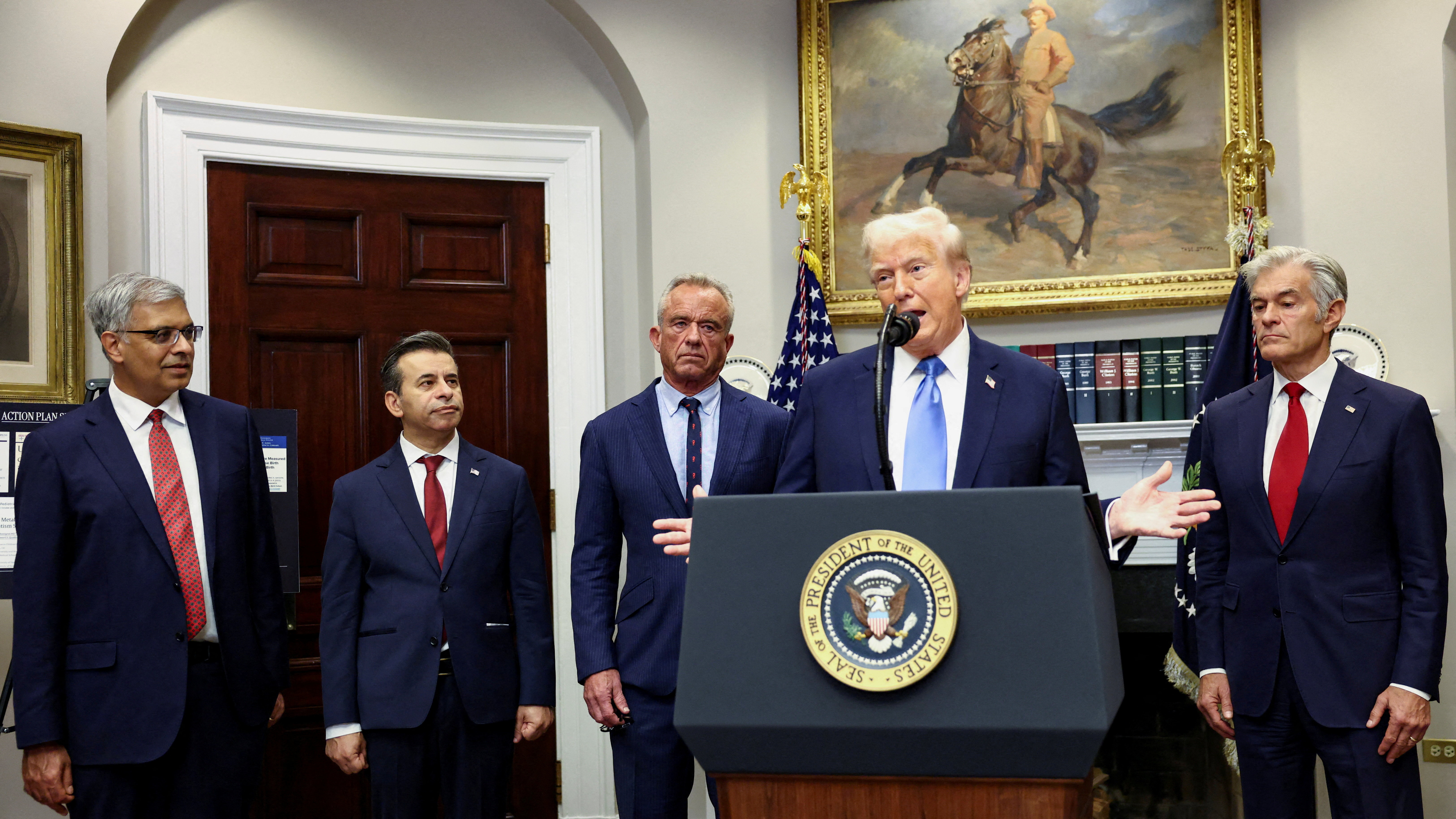 US President Donald Trump speaks, with administrator of the Centers for Medicare and Medicaid Services, Mehmet Oz, US National Institutes of Health Director Jay Bhattacharya, and others.