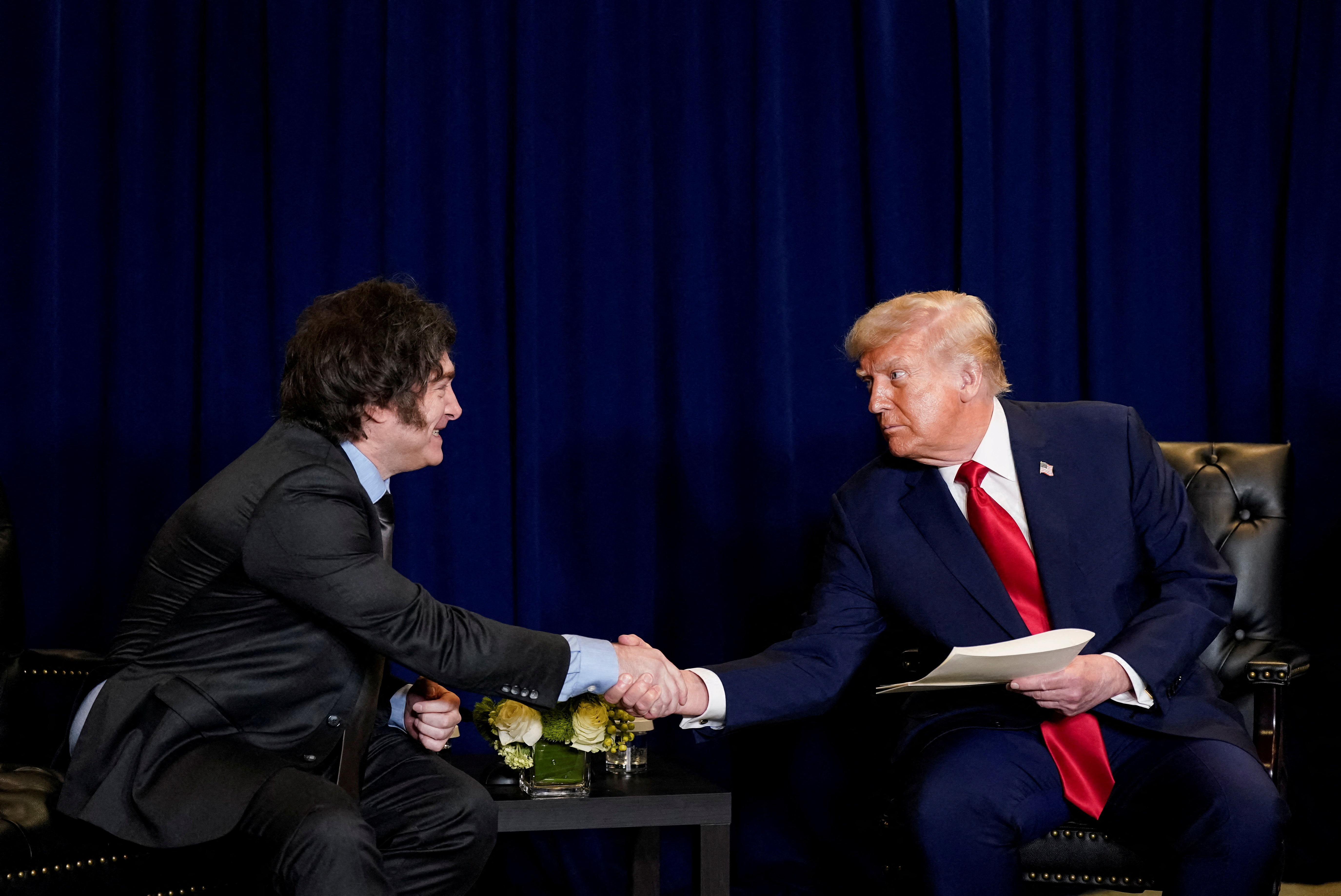 US President Donald Trump shakes hands with Argentina's President Javier Milei during the 80th United Nations General Assembly, in New York City, New York, US, September 23, 2025 [Al Drago/Reuters]