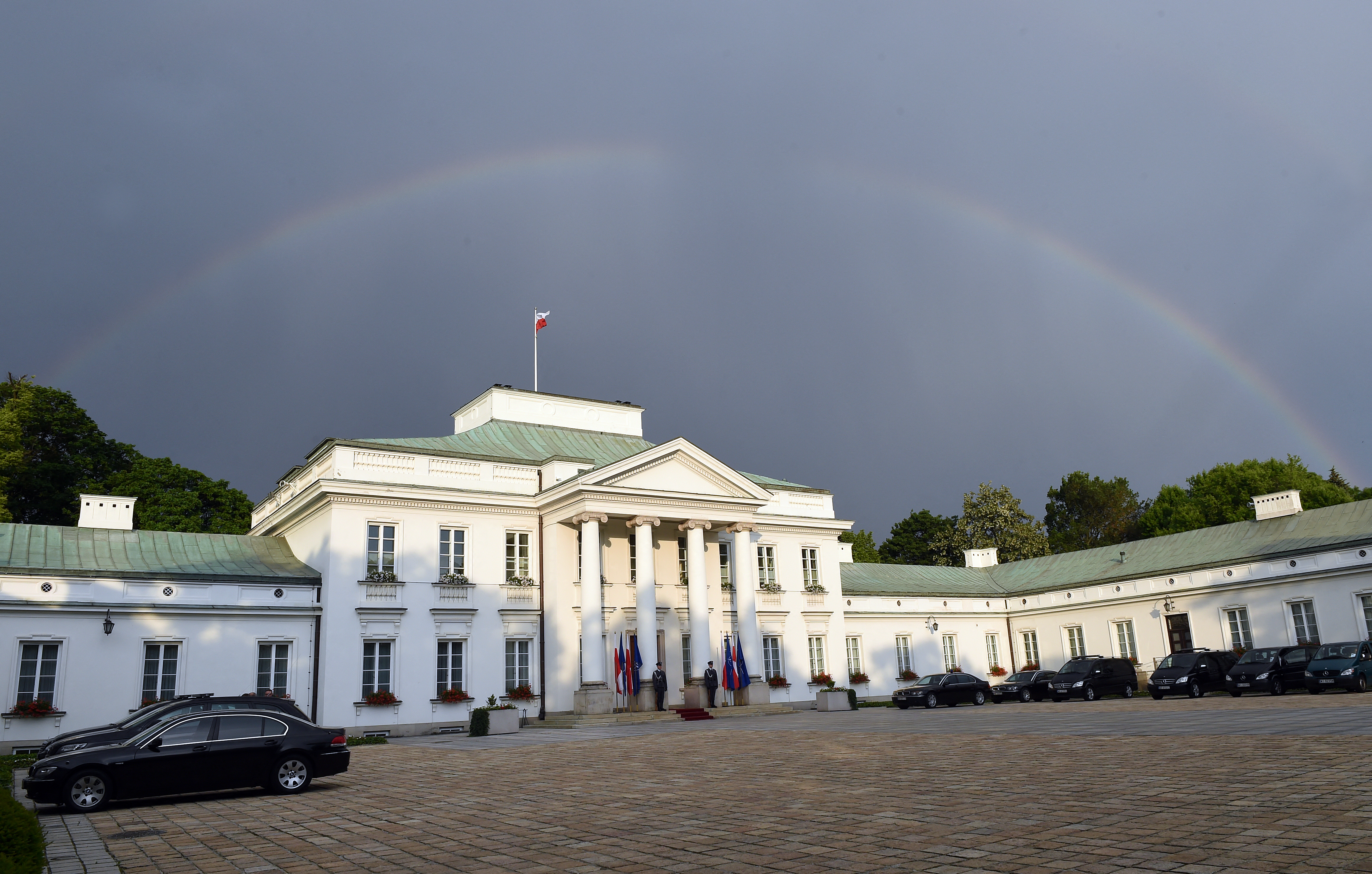 A Rainbow can be seen over Belweder Palace in Warsaw where NATO Secretary General Jens Stoltenberg and Polish President Andrzej Duda meet on May 30, 2016. (Photo by JANEK SKARZYNSKI / AFP)