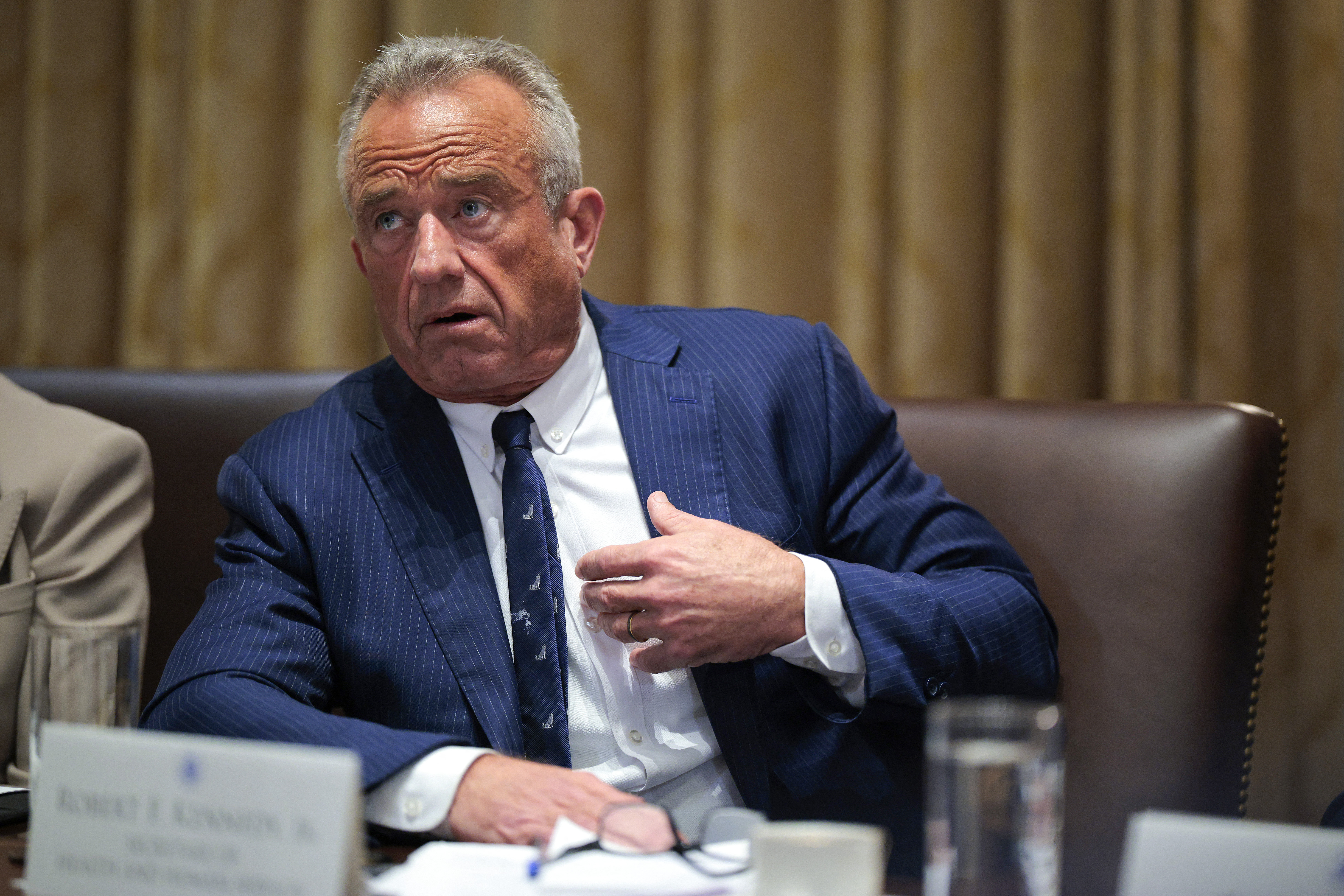 WASHINGTON, DC - AUGUST 26: U.S. Secretary of Health and Human Services Robert F. Kennedy Jr. speaks as President Donald Trump holds a cabinet meeting with members of his administration in the Cabinet Room of the White House on August 26, 2025 in Washington, DC. This is the seventh cabinet meeting of Trump's second term. Chip Somodevilla/Getty Images/AFP (Photo by CHIP SOMODEVILLA / GETTY IMAGES NORTH AMERICA / Getty Images via AFP)