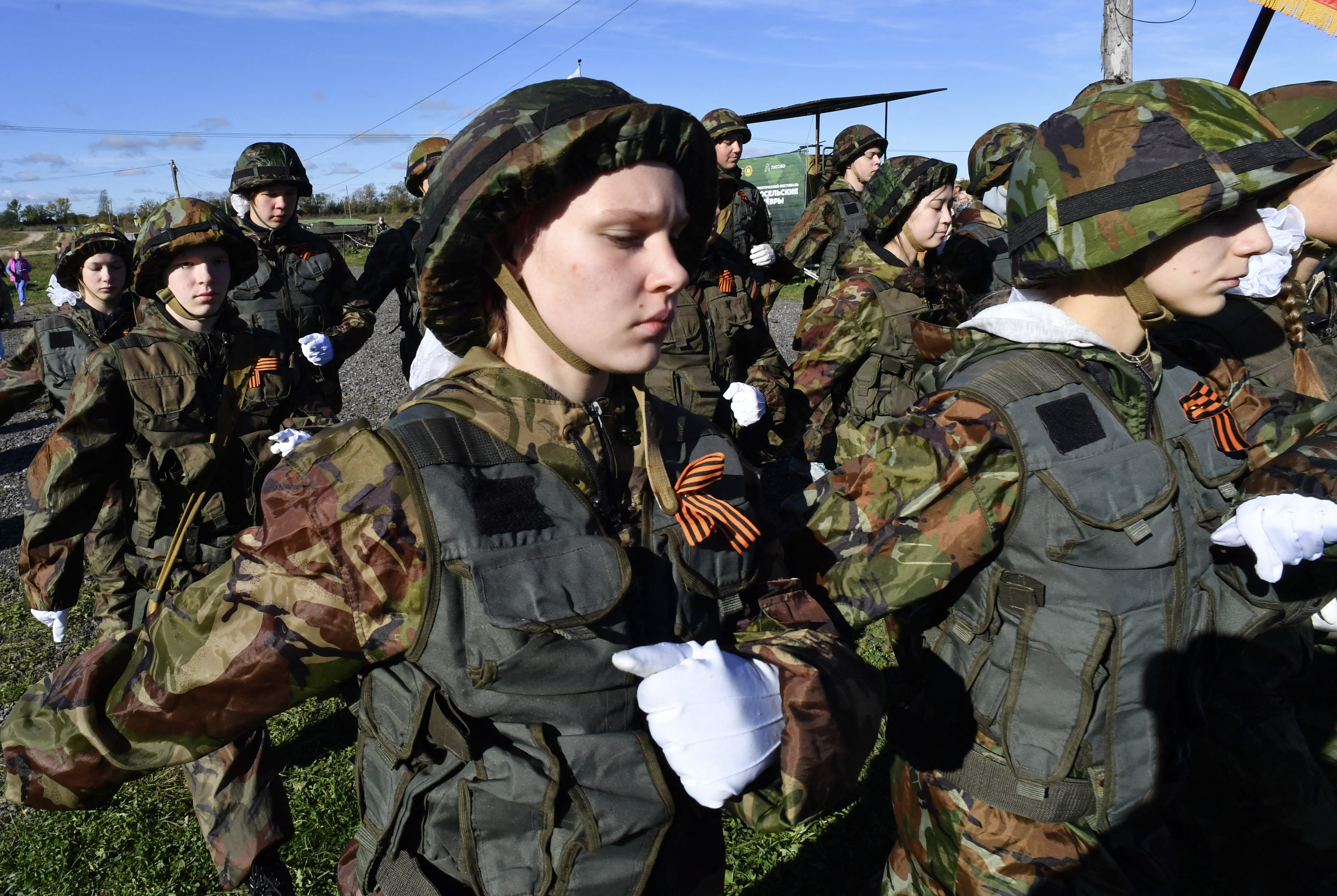 Members of the youth military-patriotic clubs, take part in competitions during the Military-Patriotic Festival in Saint Petersburg, on September 25, 2025. (Photo by Olga MALTSEVA / AFP)