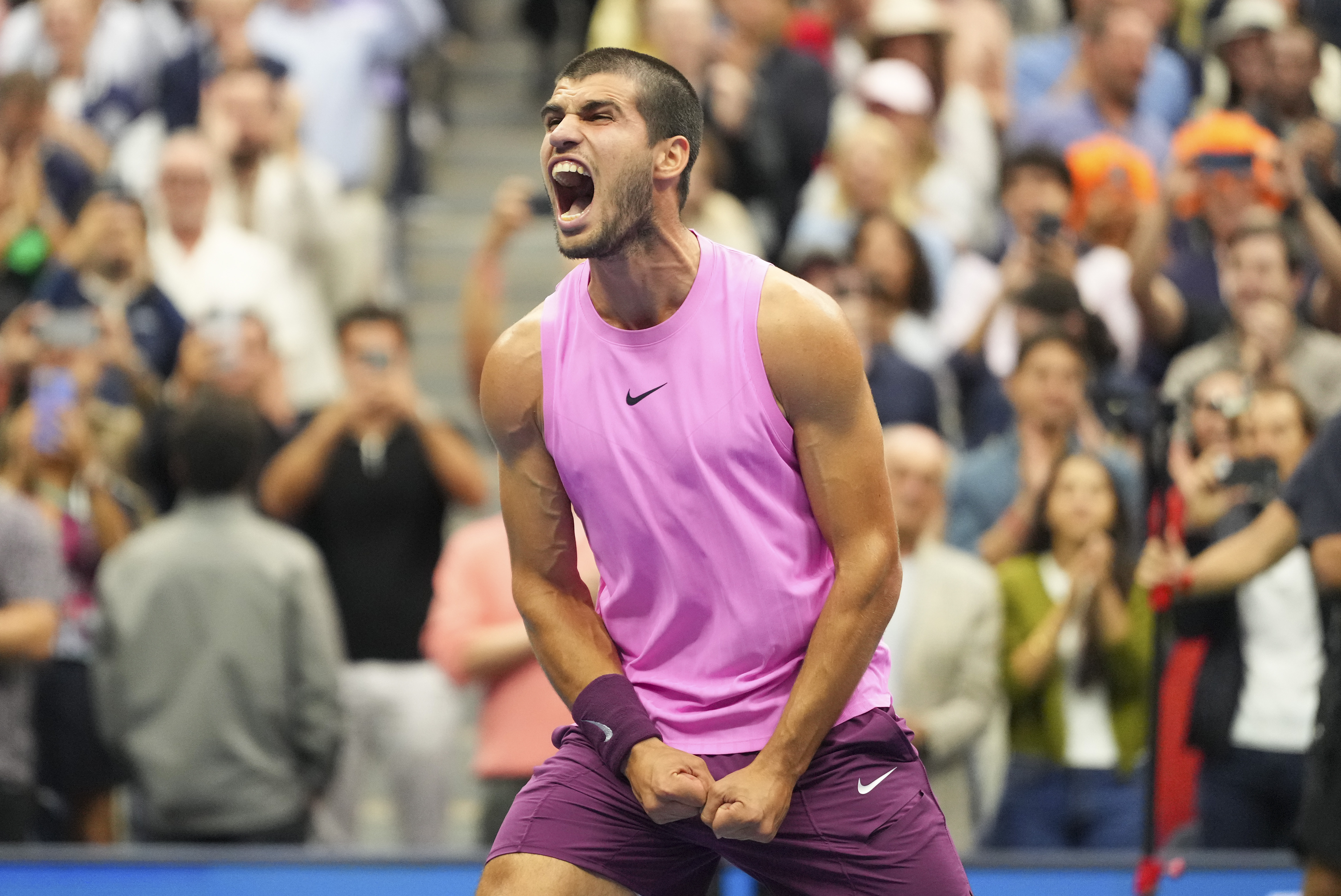 Carlos Alcaraz, of Spain, celebrates after defeating Jannik Sinner, of Italy, in the men's singles final of the U.S. Open tennis championships, Sunday, Sept. 7, 2025, in New York. (AP Photo/Kirsty Wigglesworth)