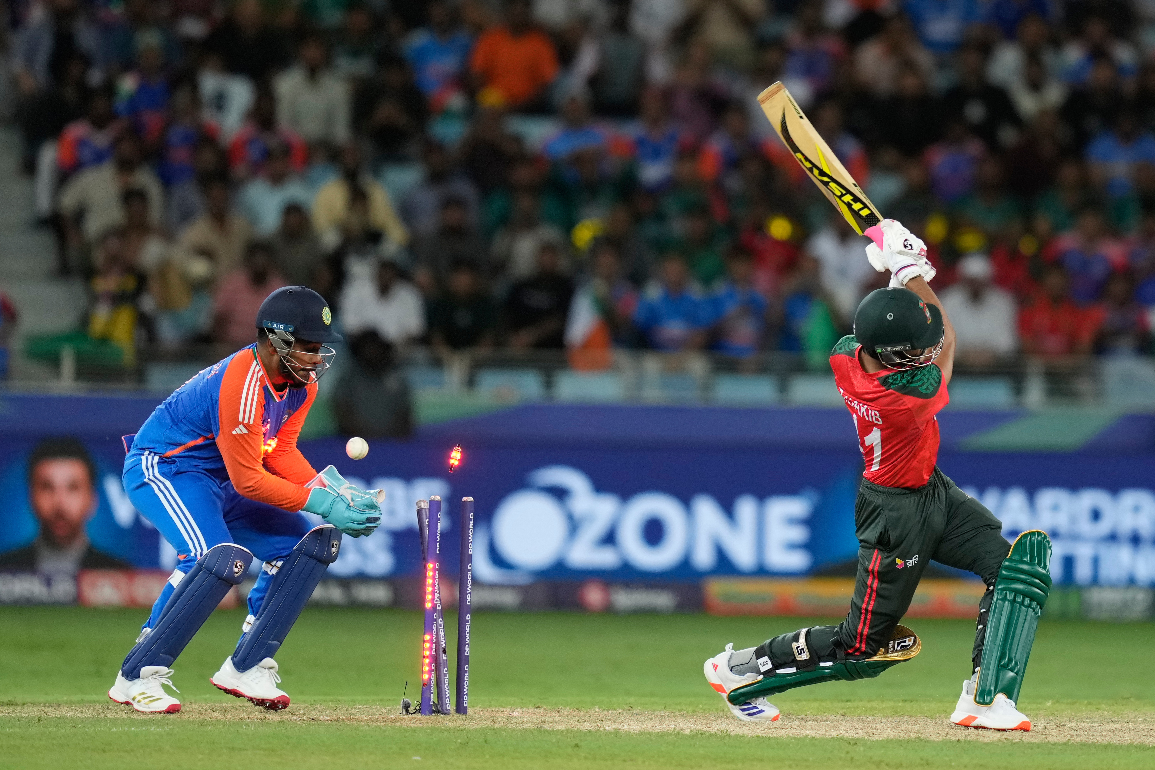 Bangladesh's Tanzim Hasan Sakib bowled out by India's Kuldeep Yadav during the Asia Cup cricket match between India and Bangladesh