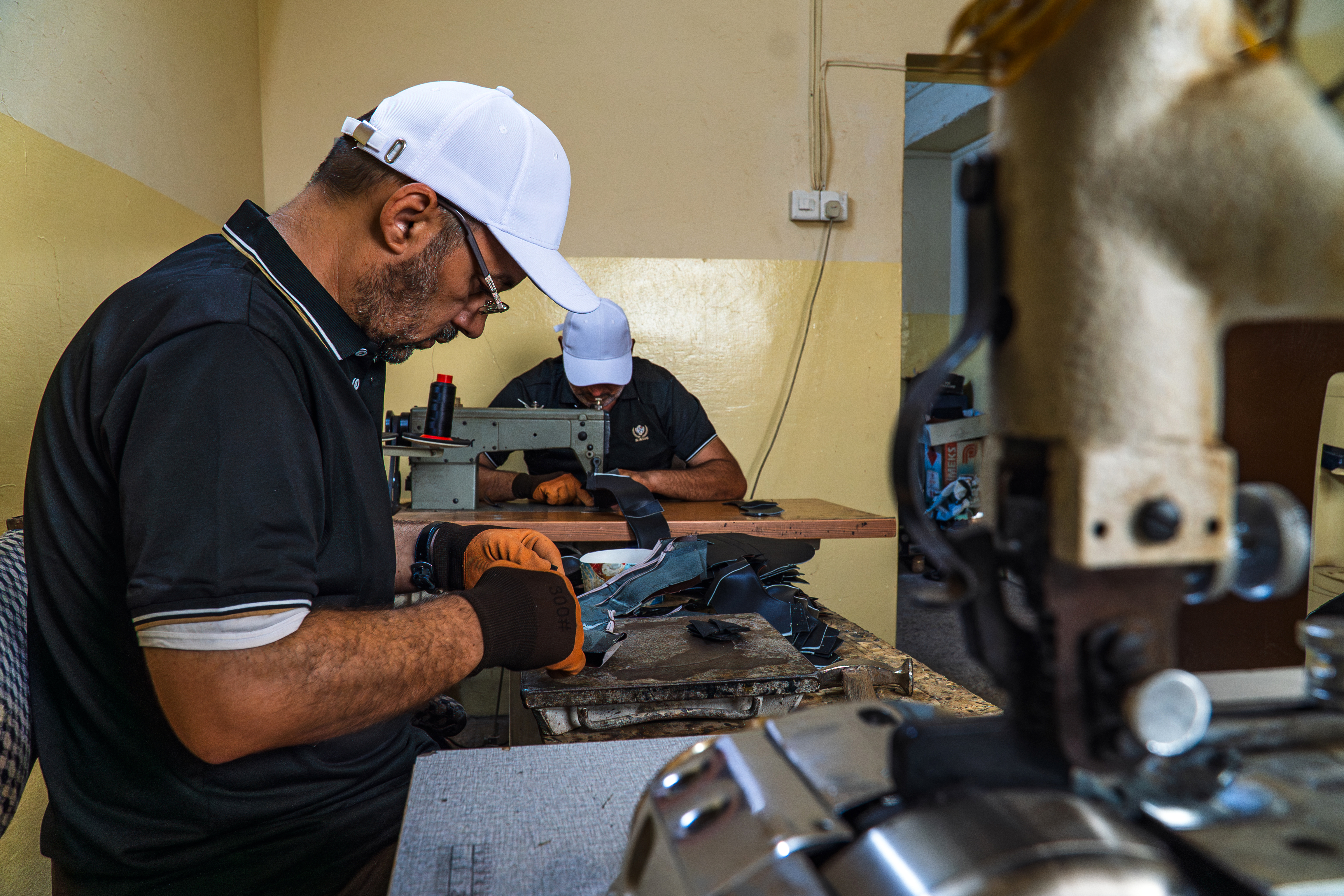 “Through the programme, I was able to buy new machines and start again,” Saad explains. Photo: IOM 2025/Aram Hakim