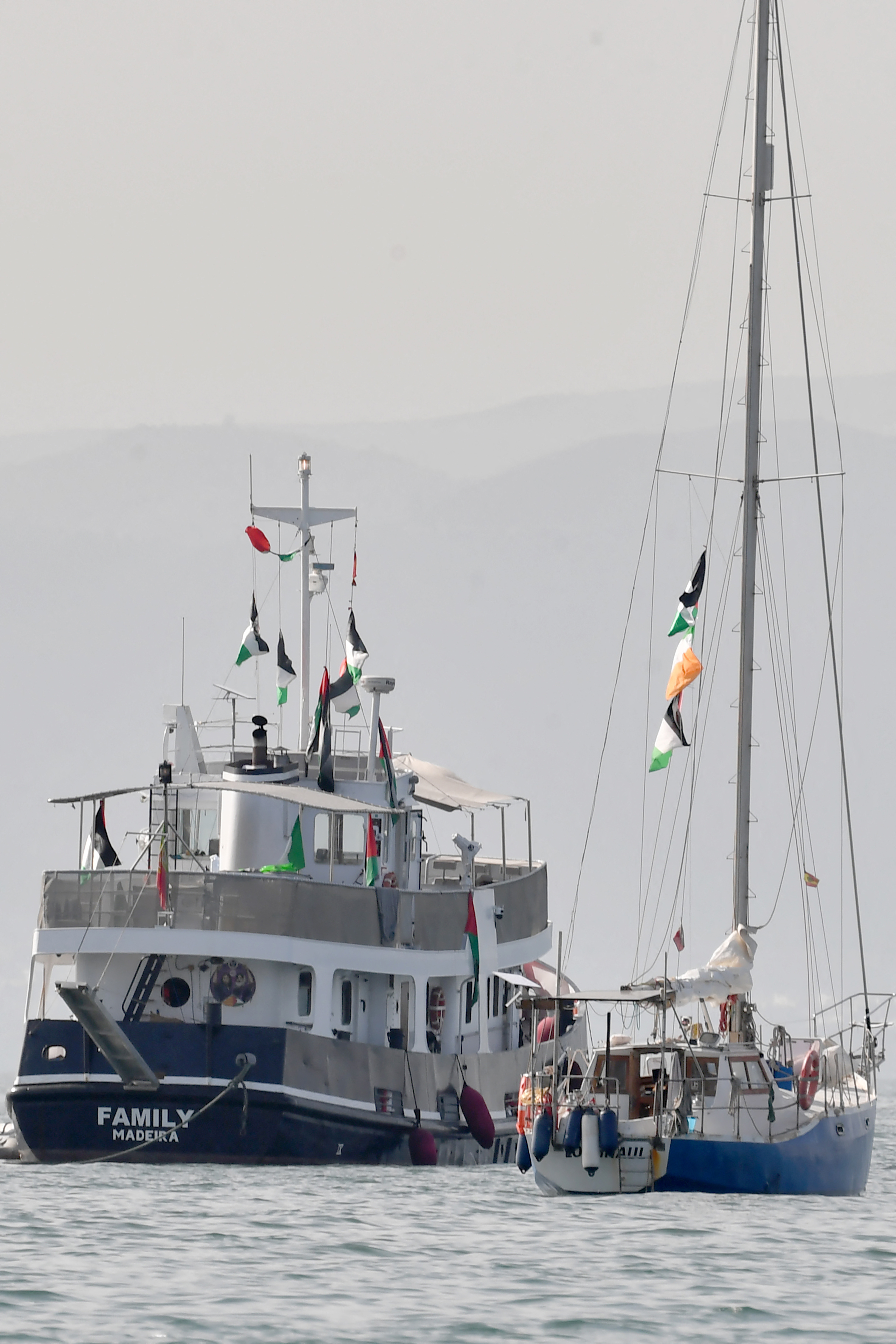 A ship, known as the "Family" and is part of the Global Sumud Flotilla, is anchored off the coast of the village of Sidi Bou Said on September 9, 2025.