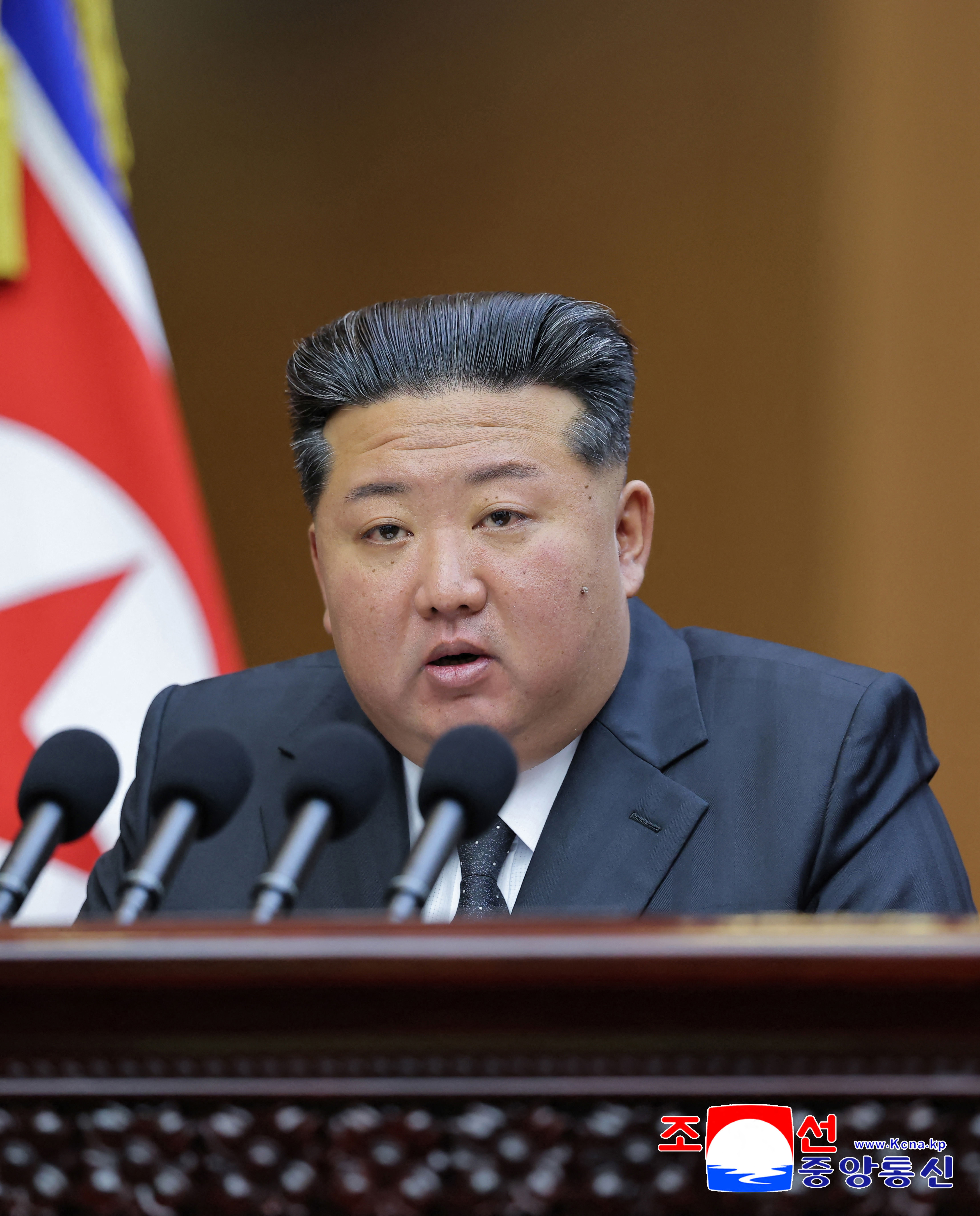 This undated picture released by North Korea's official Korean Central News Agency (KCNA) on September 22, 2025 shows North Korean leader Kim Jong Un delivering a speech at the 13th Session of the 14th Supreme People's Assembly of the Democratic People's Republic of Korea at the Mansudae Assembly Hall in Pyongyang.