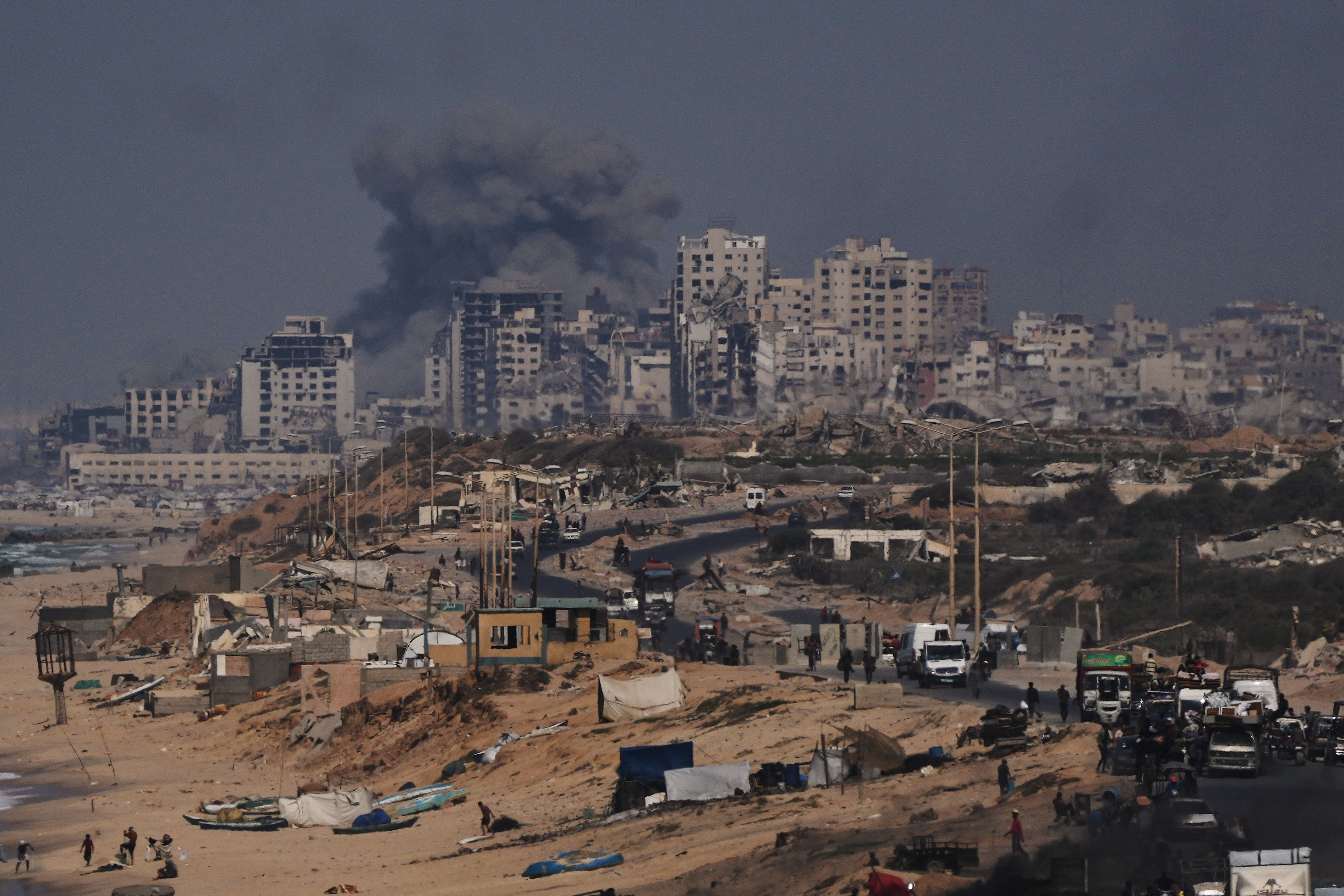 Smoke rises following an Israeli military strike in Gaza City, as seen from the central Gaza Strip, Friday, Sept. 26, 2025. (AP Photo/Abdel Kareem Hana)