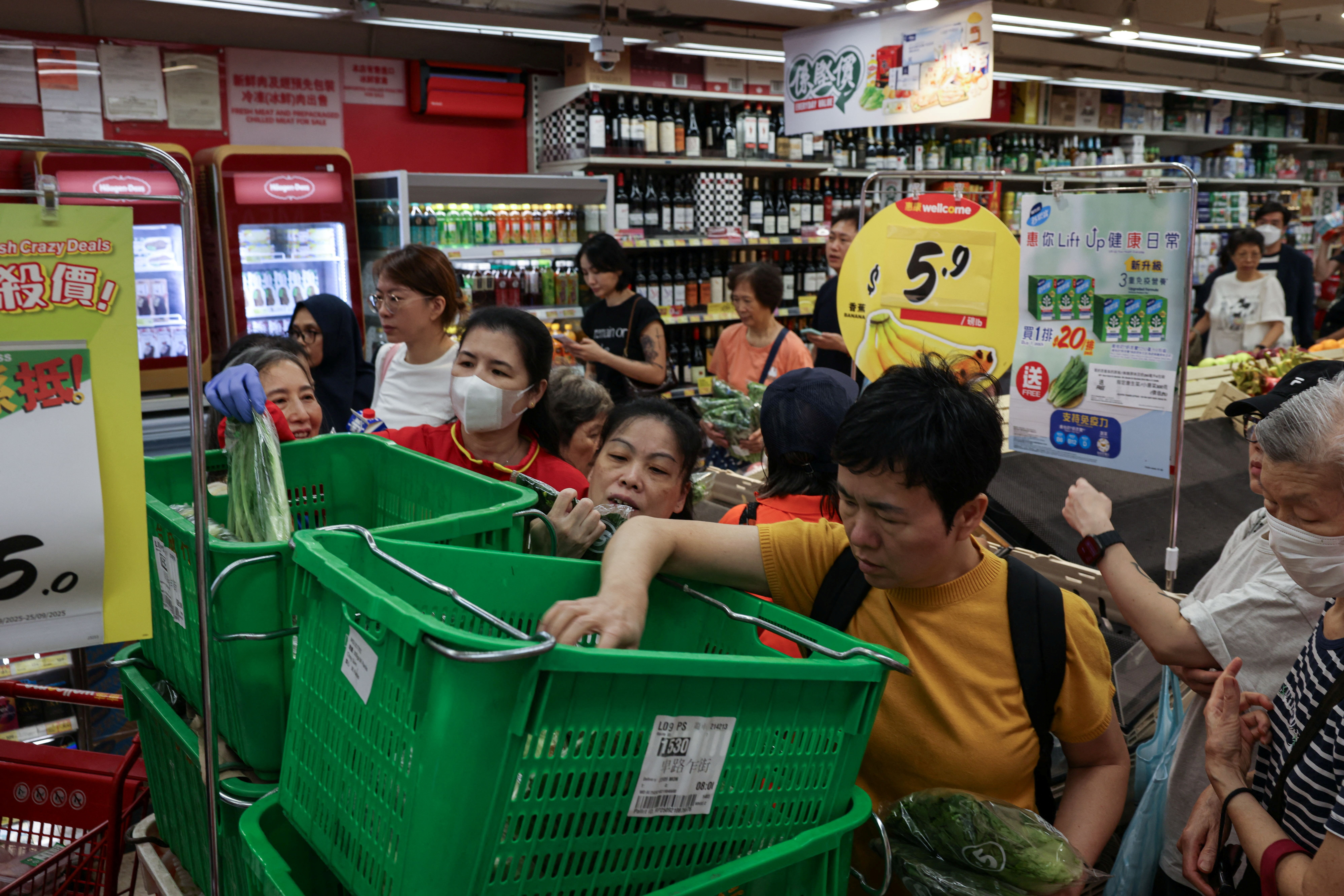 Residents stock up on supplies at a supermarket to prepare for the approaching Typhoon Ragasa, in Hong Kong, China, September 22, 2025. REUTERS/Tyrone Siu