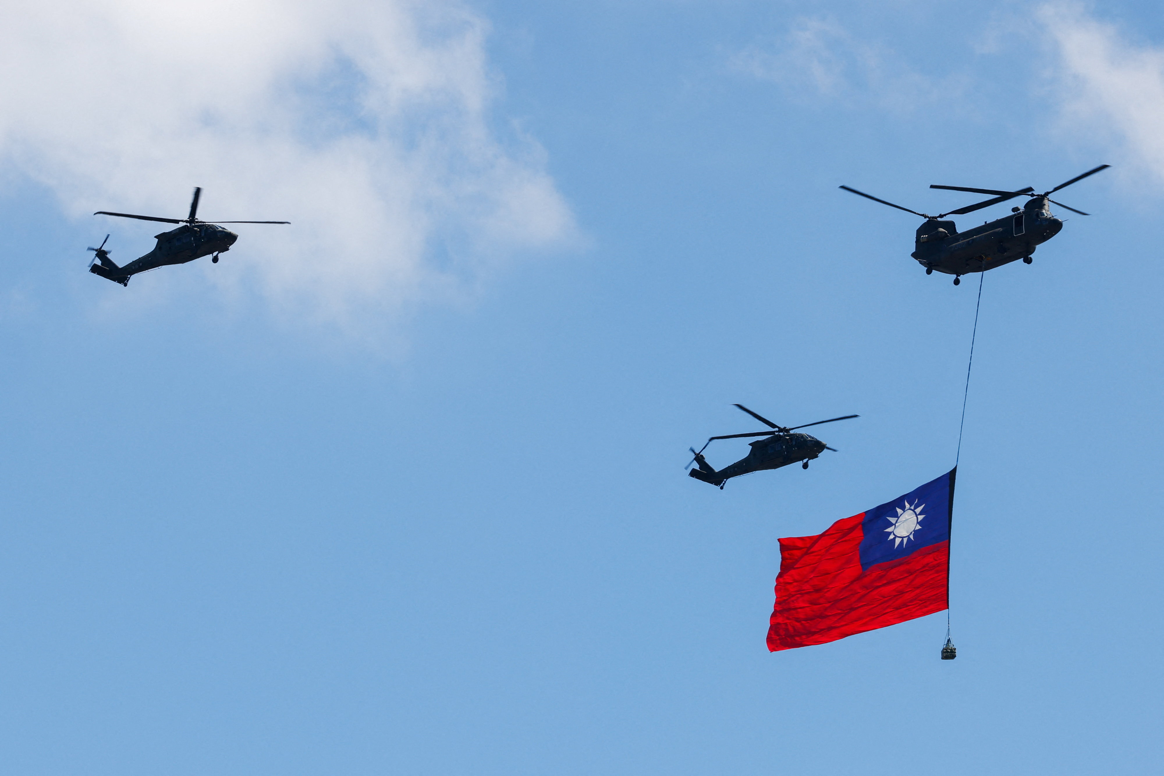 Taiwan's flag is carried across the sky during National Day celebrations in Taipei, Taiwan