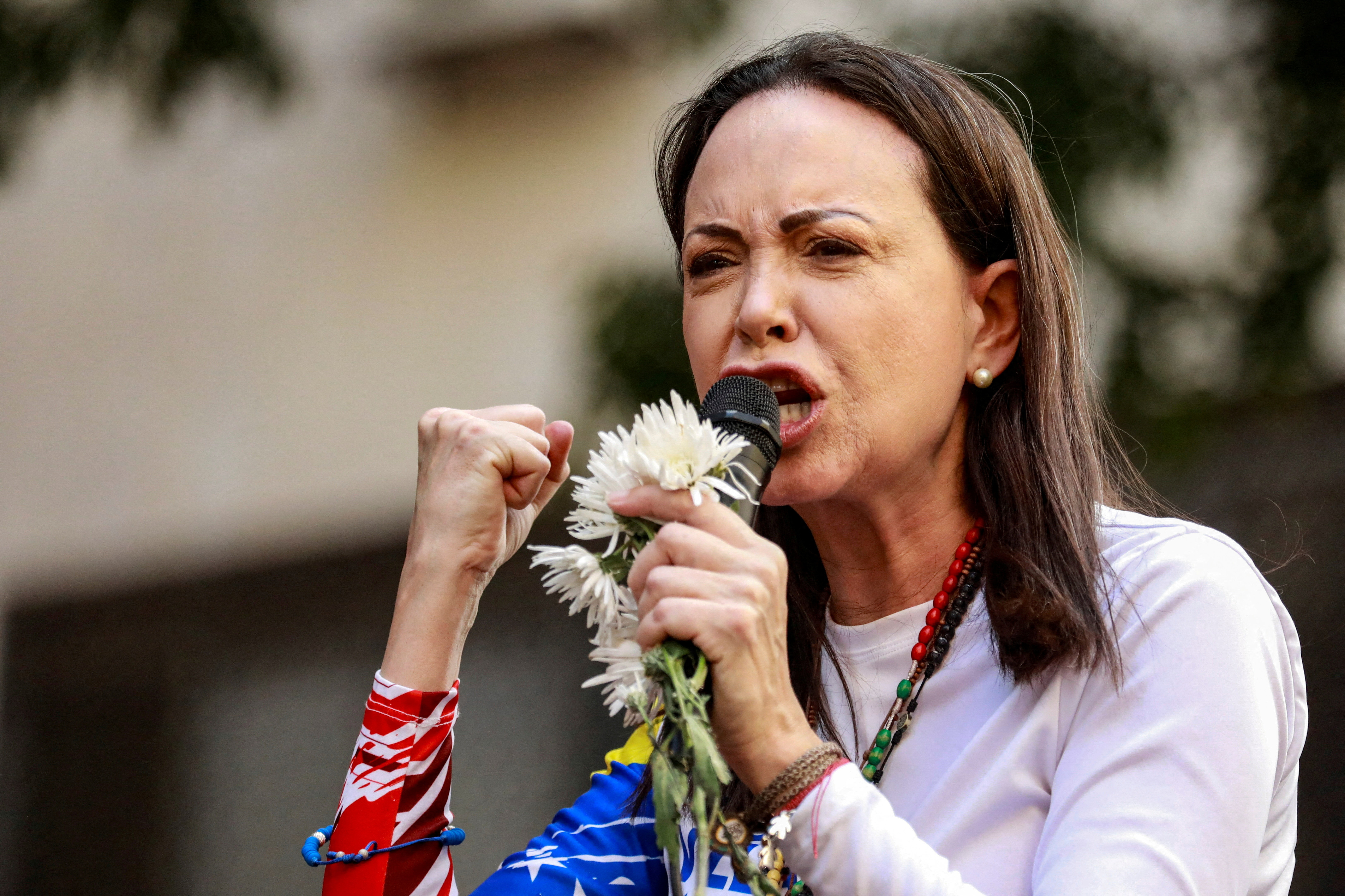Venezuelan opposition leader Maria Corina Machado addresses supporters at a protest.