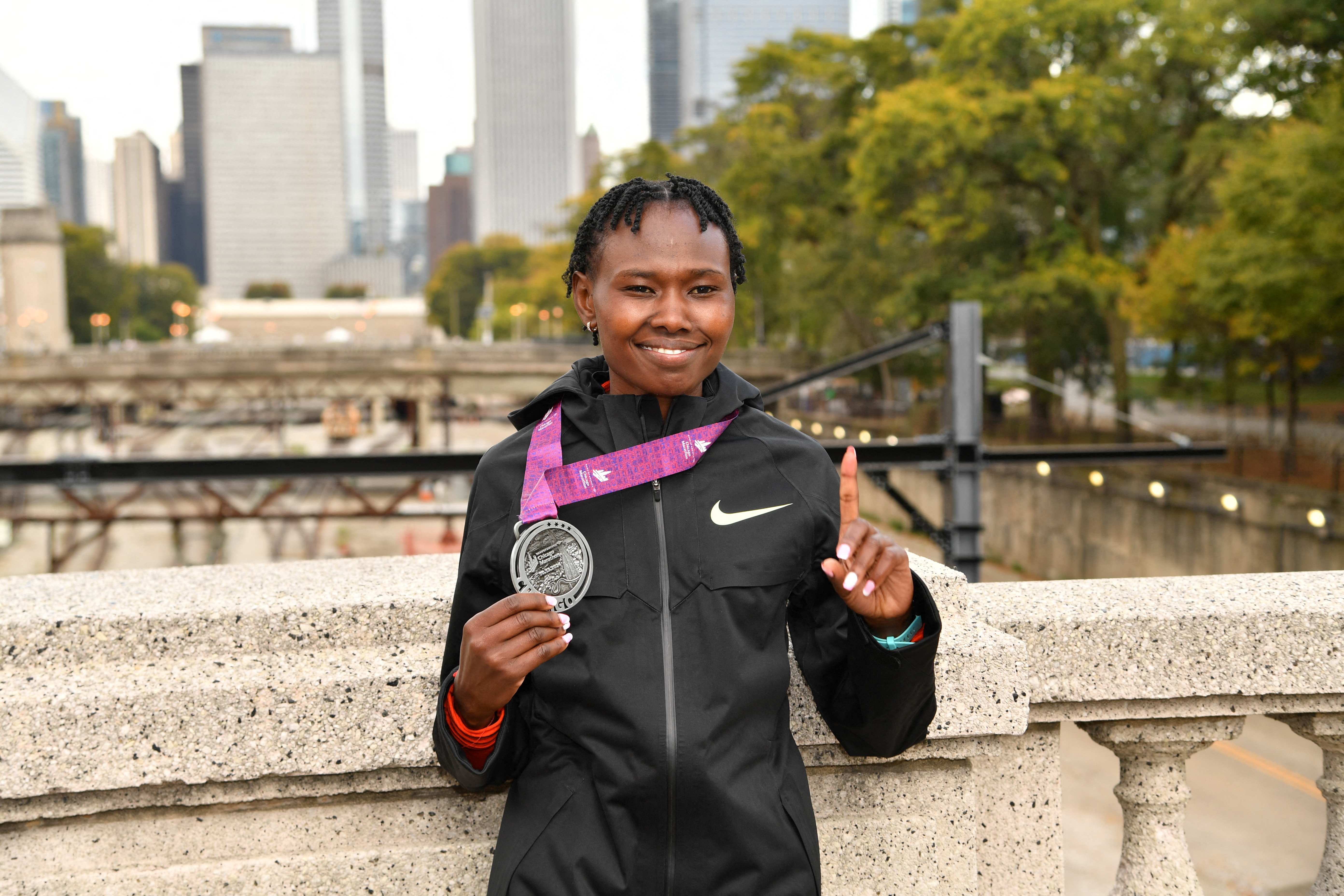 Ruth Chepngetich of Kenya poses after finishing first in the women?s race, setting a world record at 2:09:56 during the Chicago Marathon at Grant Park