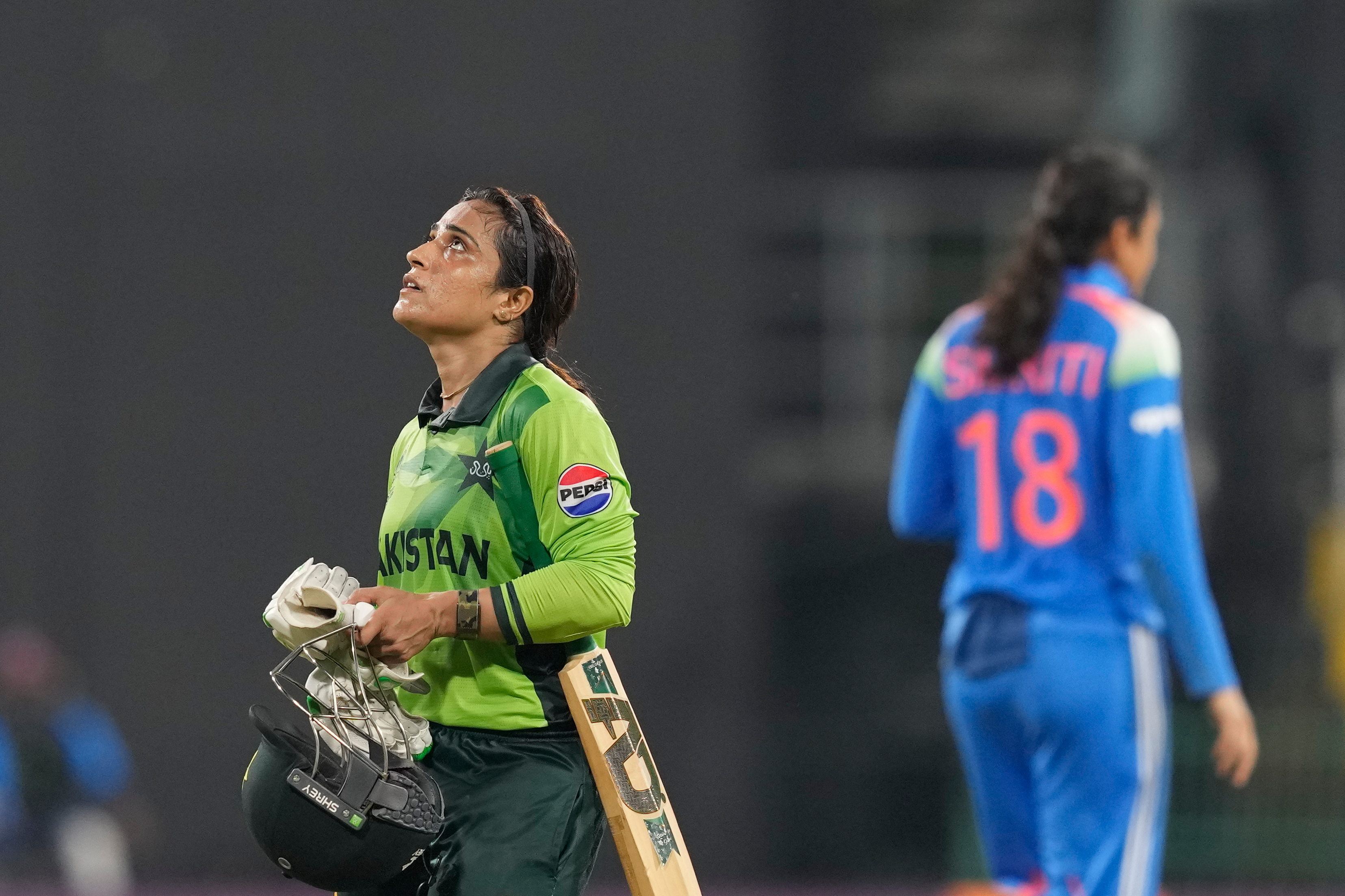 Pakistan's Sidra Amin leaves the ground after losing her wicket during the ICC Women's Cricket World Cup match between India and Pakistan at Premadasa Stadium in Colombo, Sri Lanka, Sunday, Oct, 5, 2025. (AP Photo/Eranga Jayawardena)