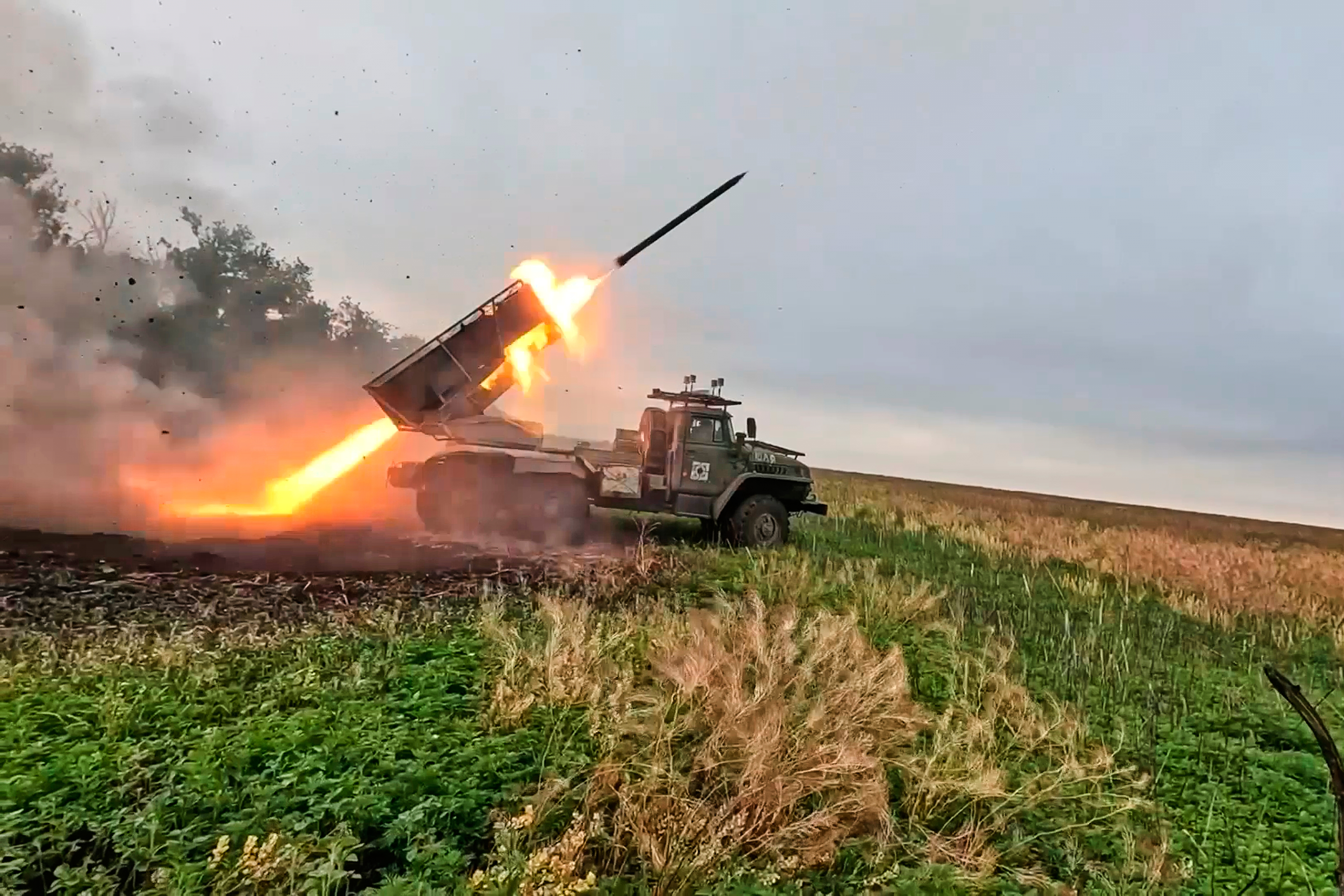 In this photo taken from video distributed by Russian Defense Ministry Press Service on Monday, Oct. 6, 2025, a Russian "Grad" self-propelled 122 mm multiple rocket launcher fires towards Ukrainian positions on an undisclosed location in Ukraine. (Russian Defense Ministry Press Service via AP)