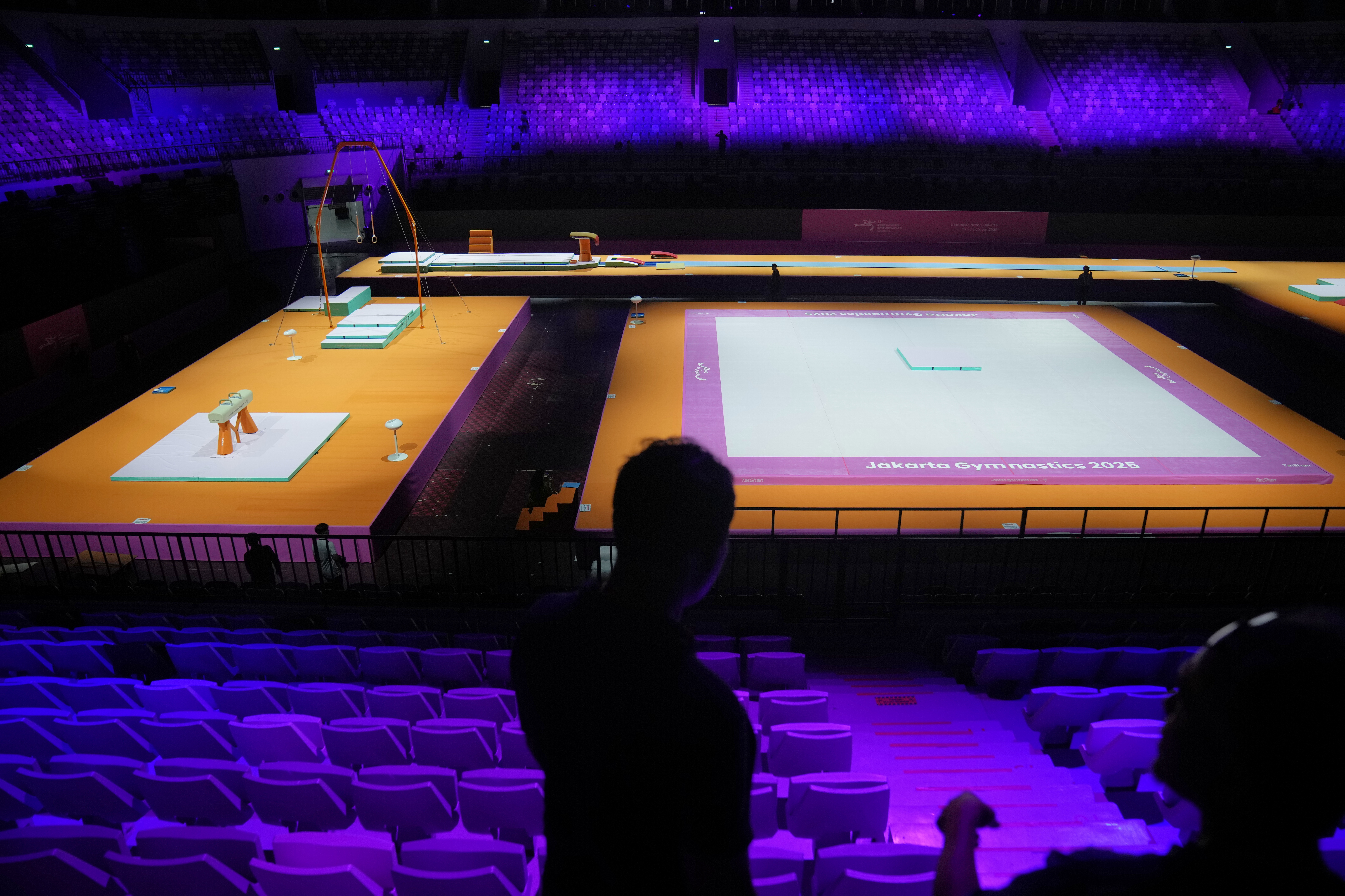 Workers are seen at the venue prepared for the Artistic Gymnastics World Championships at Indonesia Arena in Jakarta, Indonesia