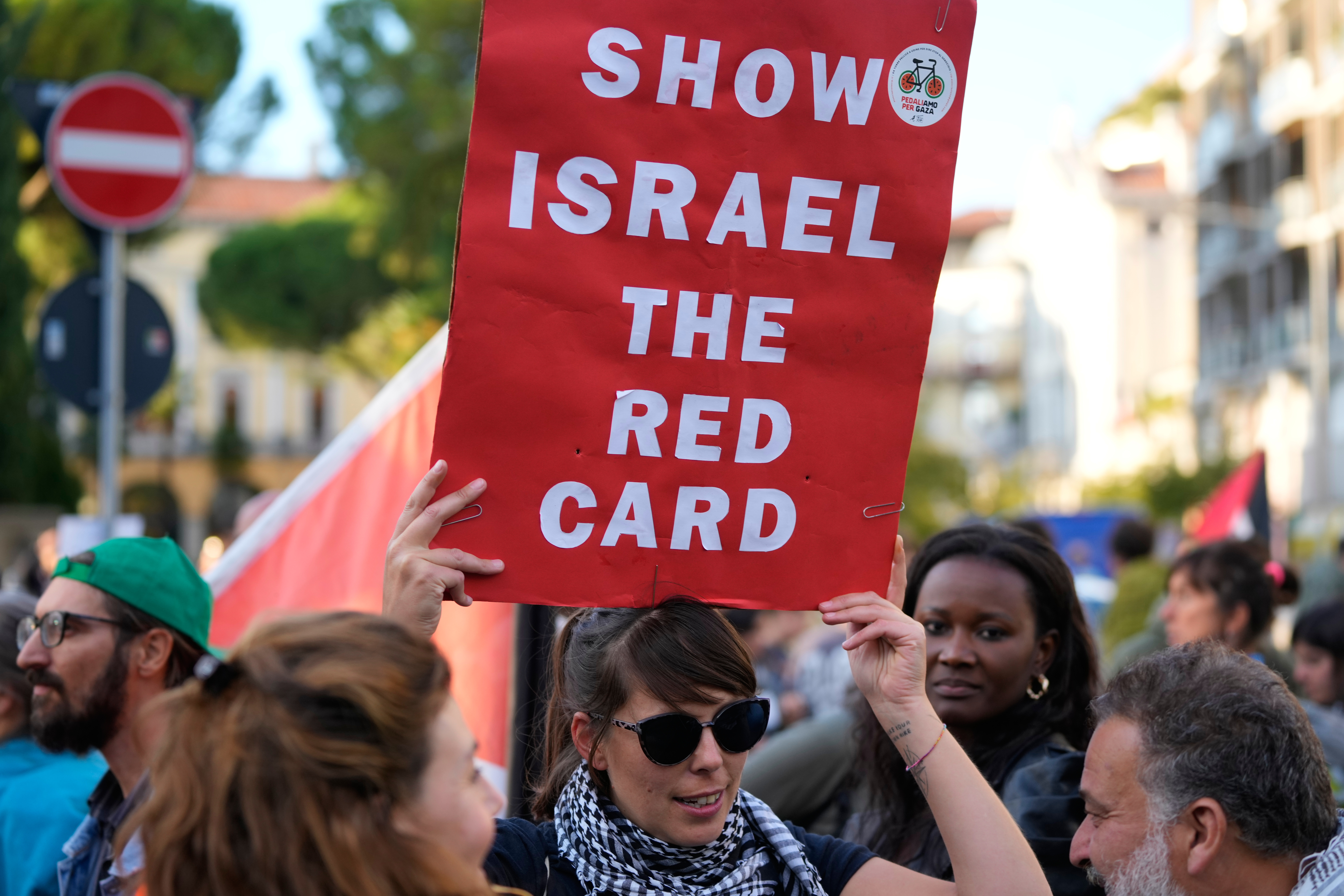 People march in Italy demanding Israel boycott before World Cup qualifier.
