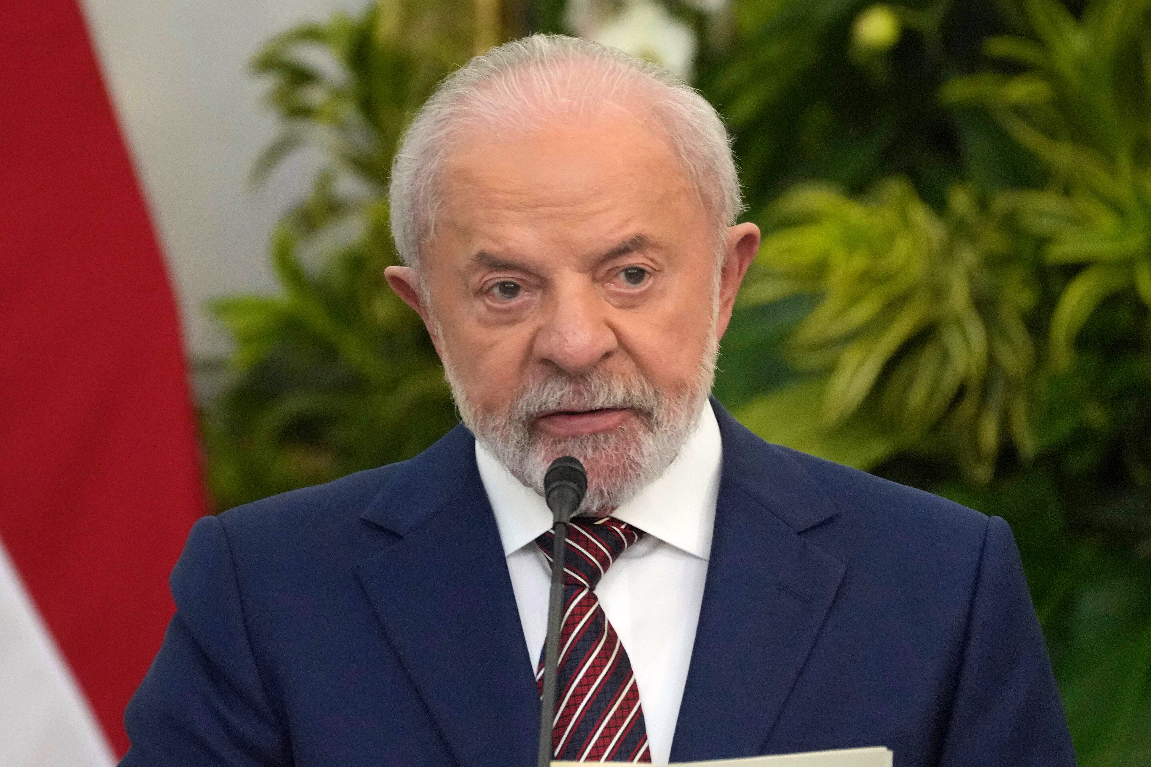 Luiz Inacio Lula da Silva speaks into a mic