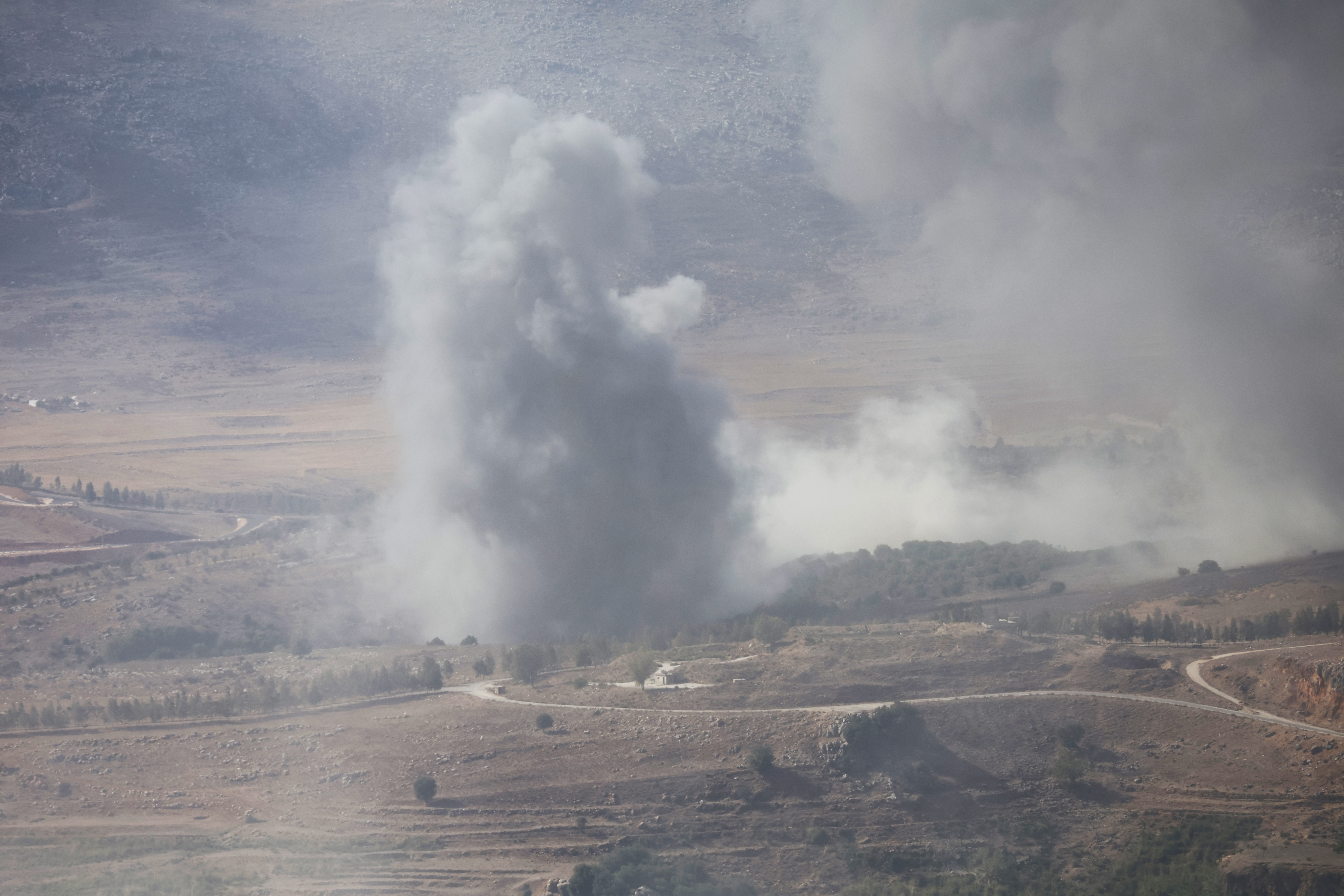 Smoke rises following an Israeli airstrike on the outskirts of the southern Lebanese village of Ej Jarmaq on October 20, 2025.