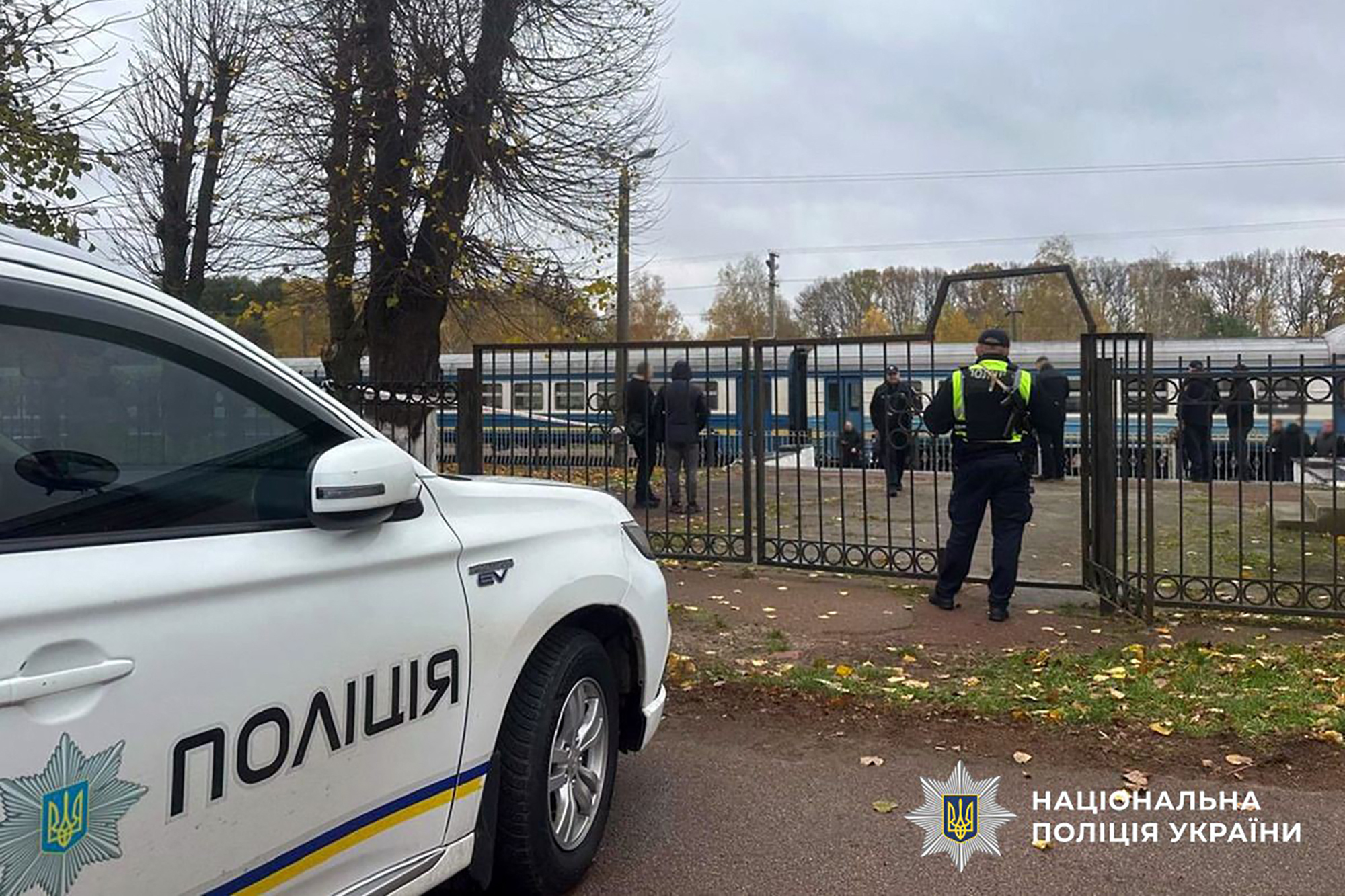 In this handout photograph taken and released by the National Police of Ukraine on October 24, 2025, Ukrainian police officers work at the train station following a grenade explosion in Ovruch, Zhytomyr region, amid the Russian invasion in Ukraine.