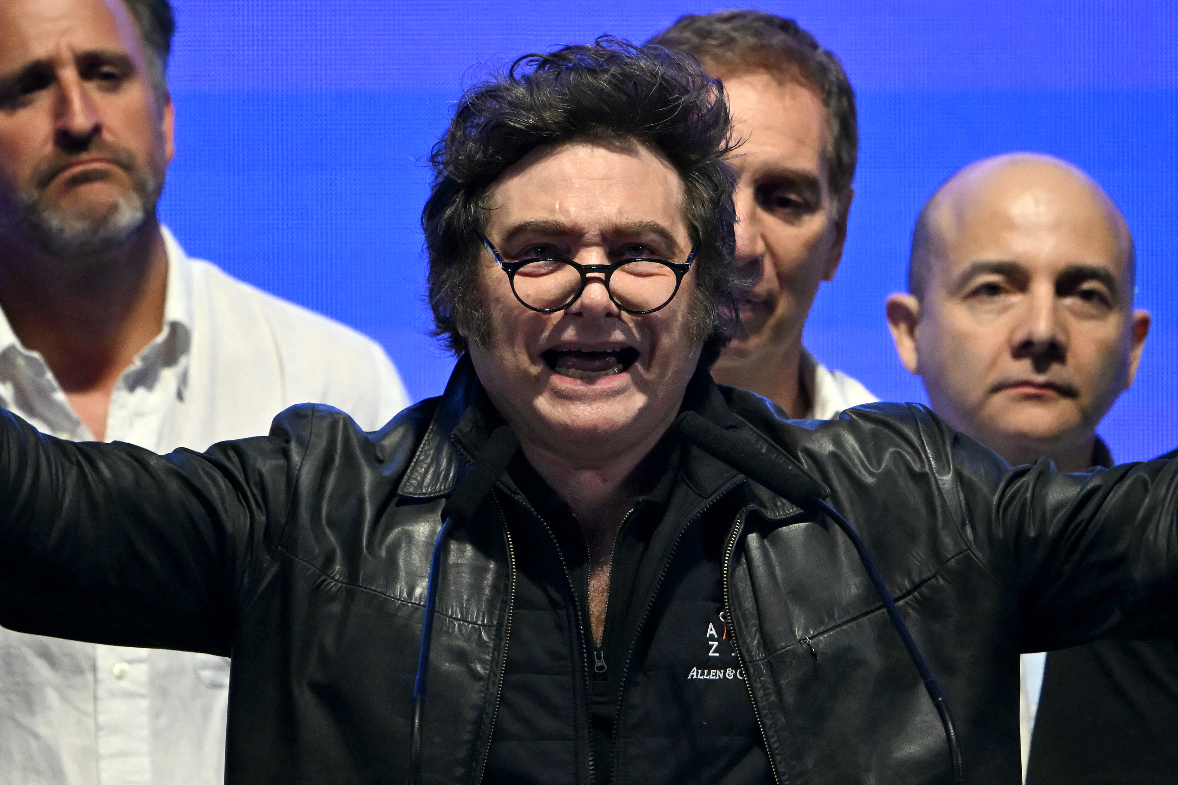Argentina's President Javier Milei (C) speaks to supporters during the closing campaign rally of Libertad Avanza party ahead of the upcoming legislative elections in Rosario, Santa Fe province, Argentina on October 23, 2025.
