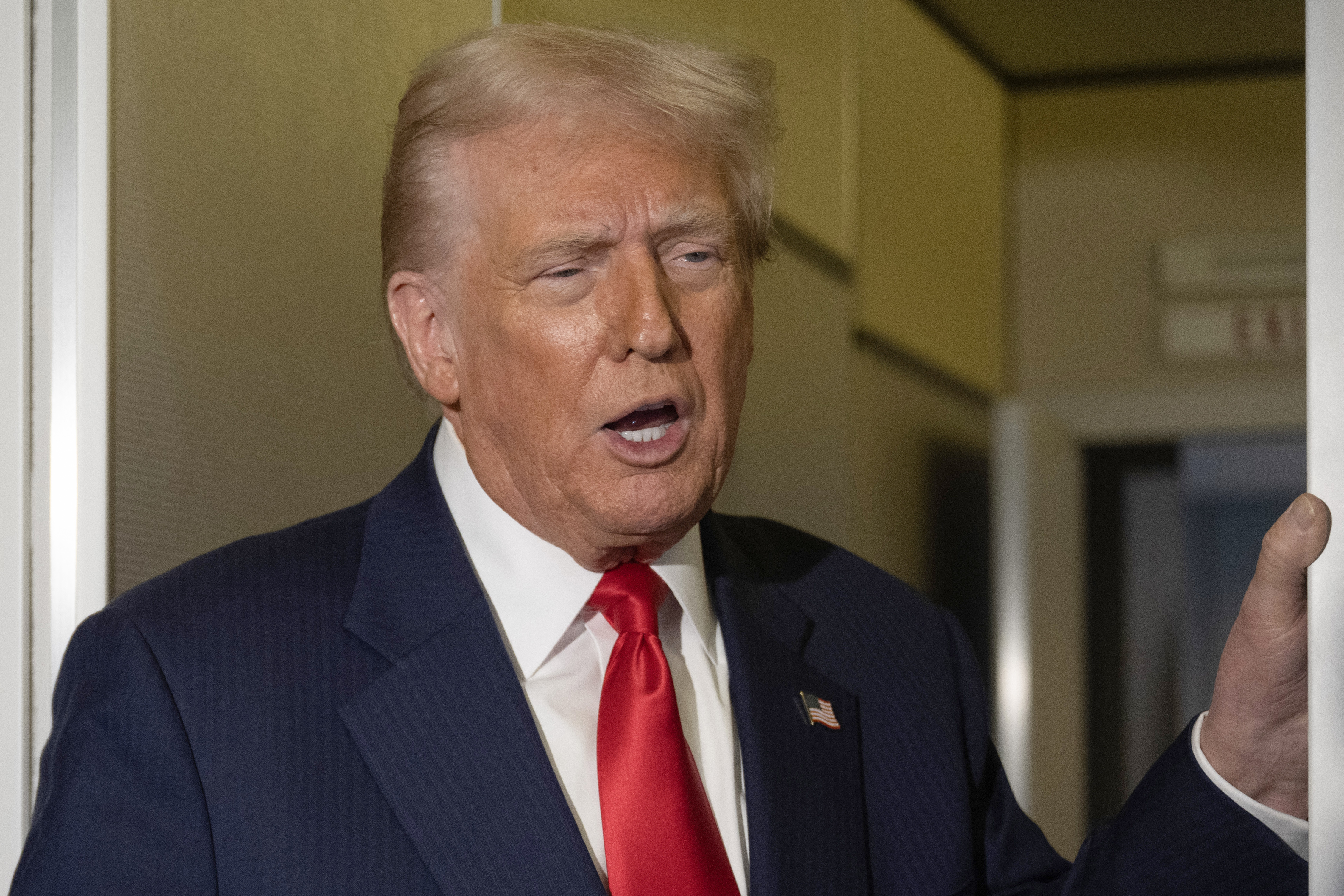 US President Donald Trump speaks to the media aboard Air Force One as he returns to the United States on October 30, 2025. (Photo by ANDREW CABALLERO-REYNOLDS / AFP)