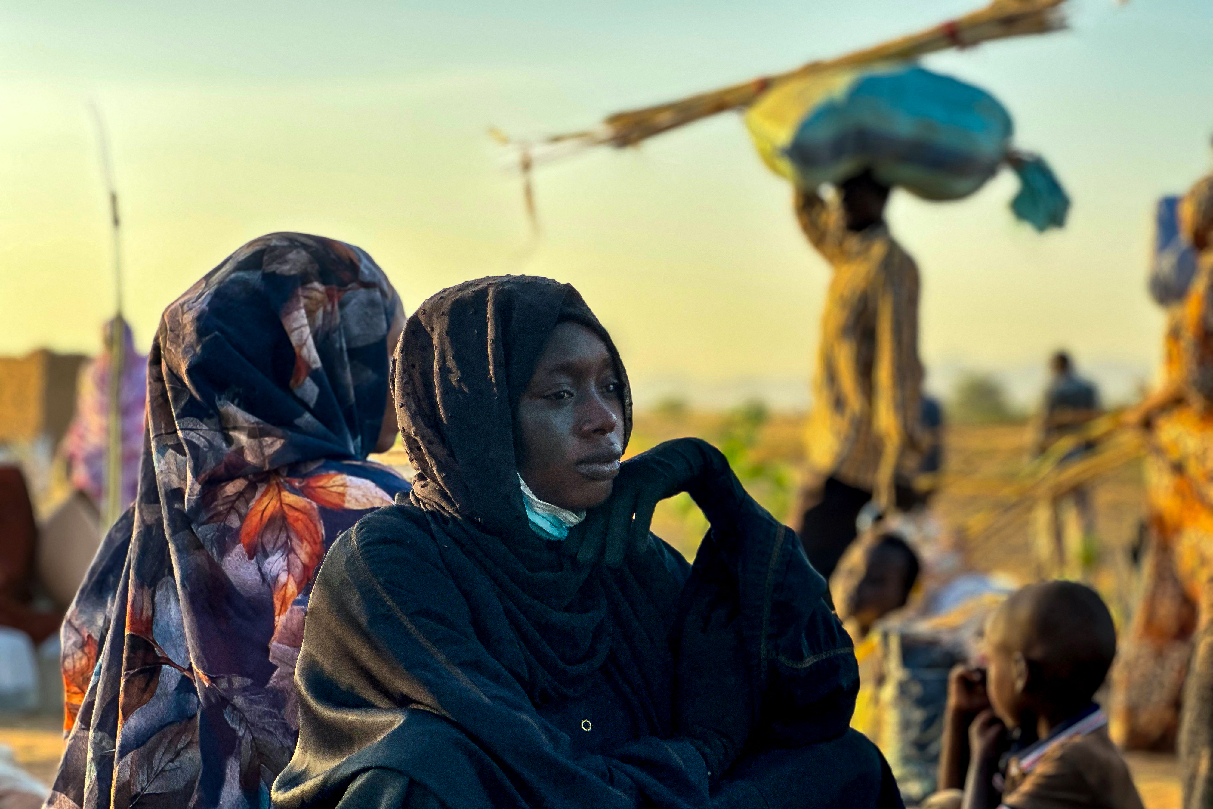 TOPSHOT - A displaced woman rests in Tawila, in the country's war-torn western Darfur region, on October 28, 2025, after fleeing El-Fasher following the city’s fall to the Rapid Support Forces (RSF).