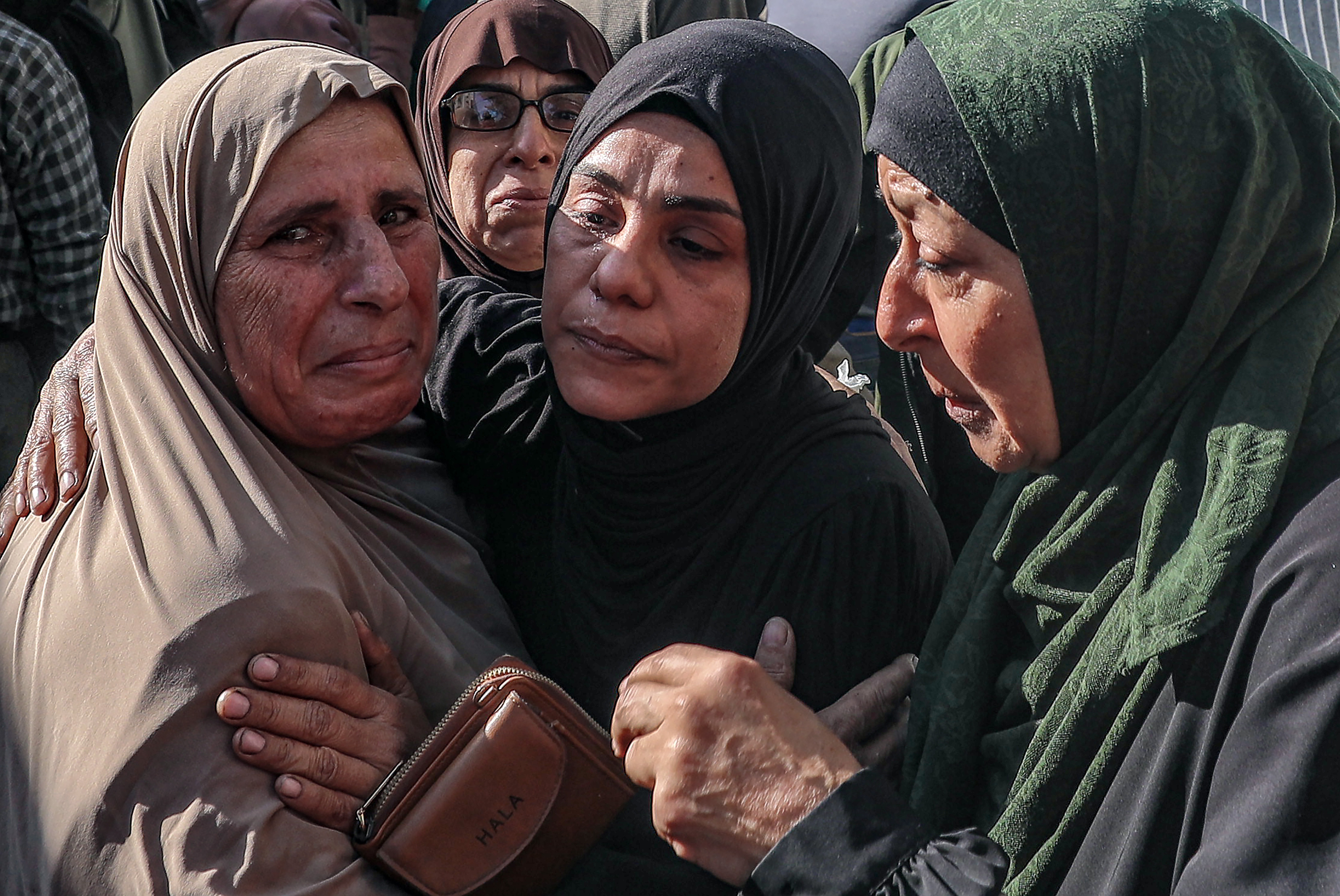 Relatives of Palestinians killed in Israeli airstrikes mourn at Al-Shifa Hospital in Gaza City, 23 November 2025. [Mohammed Saber/EPA]
