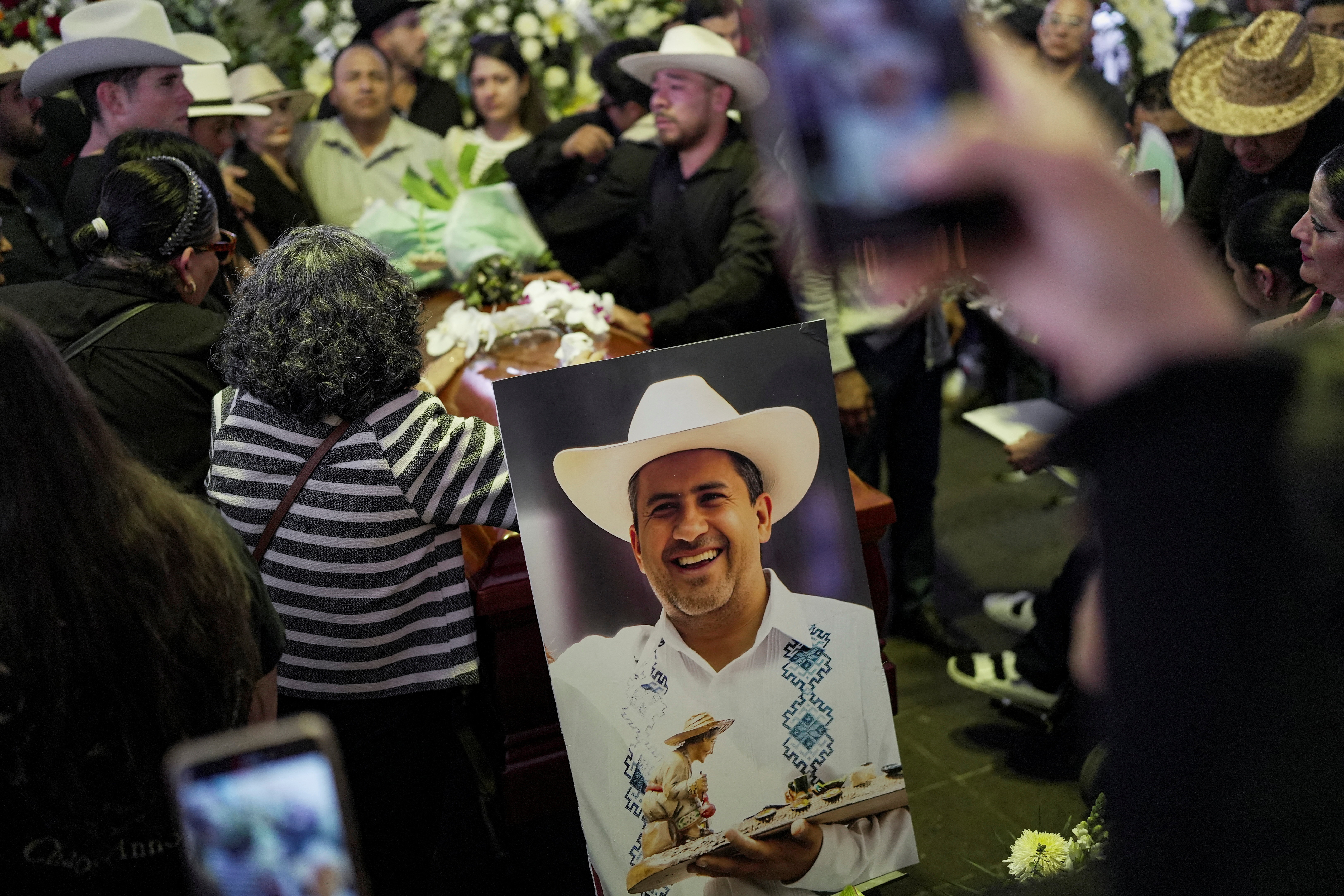 Family and friends attend the funeral of Carlos Manzo, the mayor who was shot dead during a Day of the Dead event, in Uruapan, Mexico, November 2, 2025.