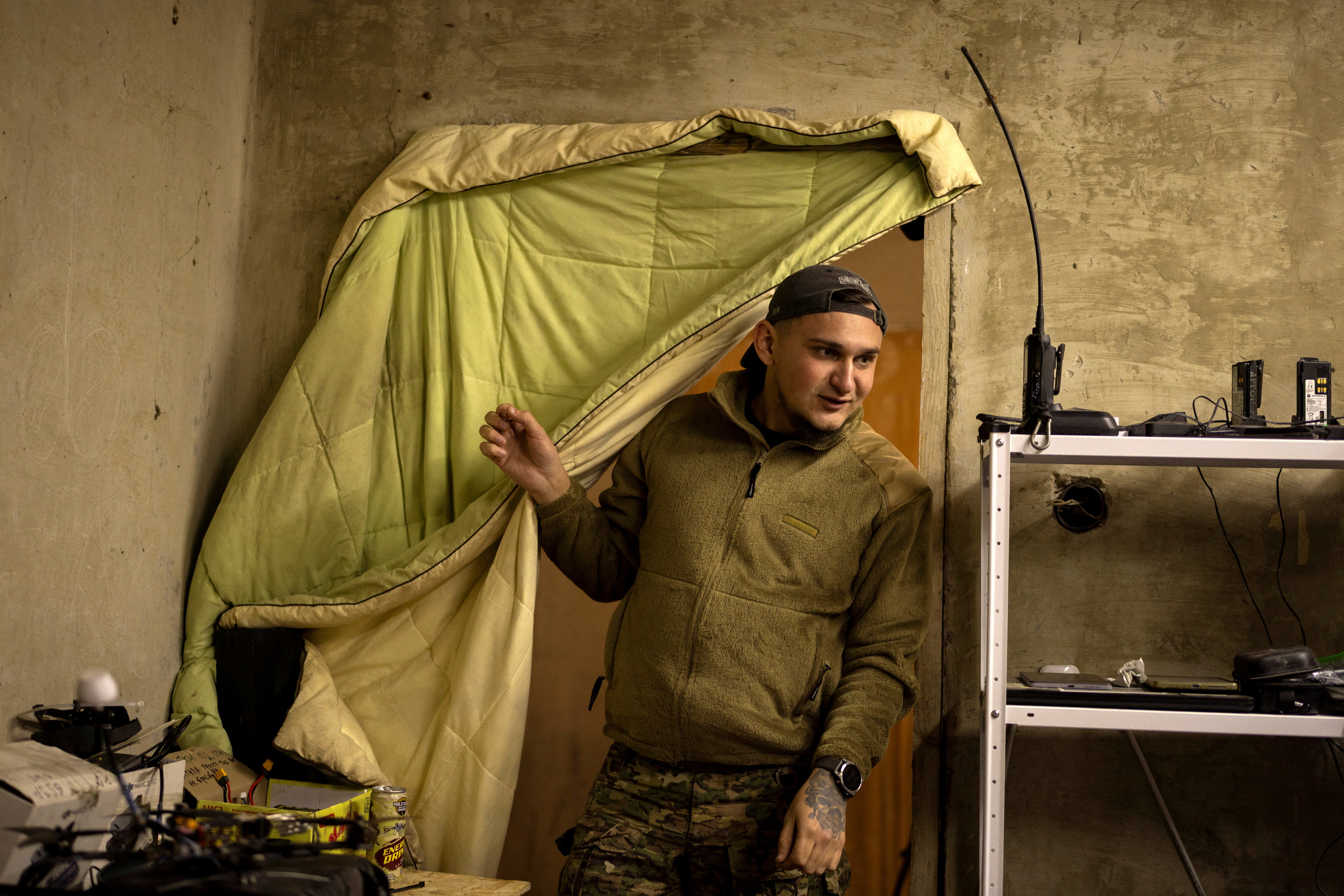 A serviceman enters a room in a rest house.