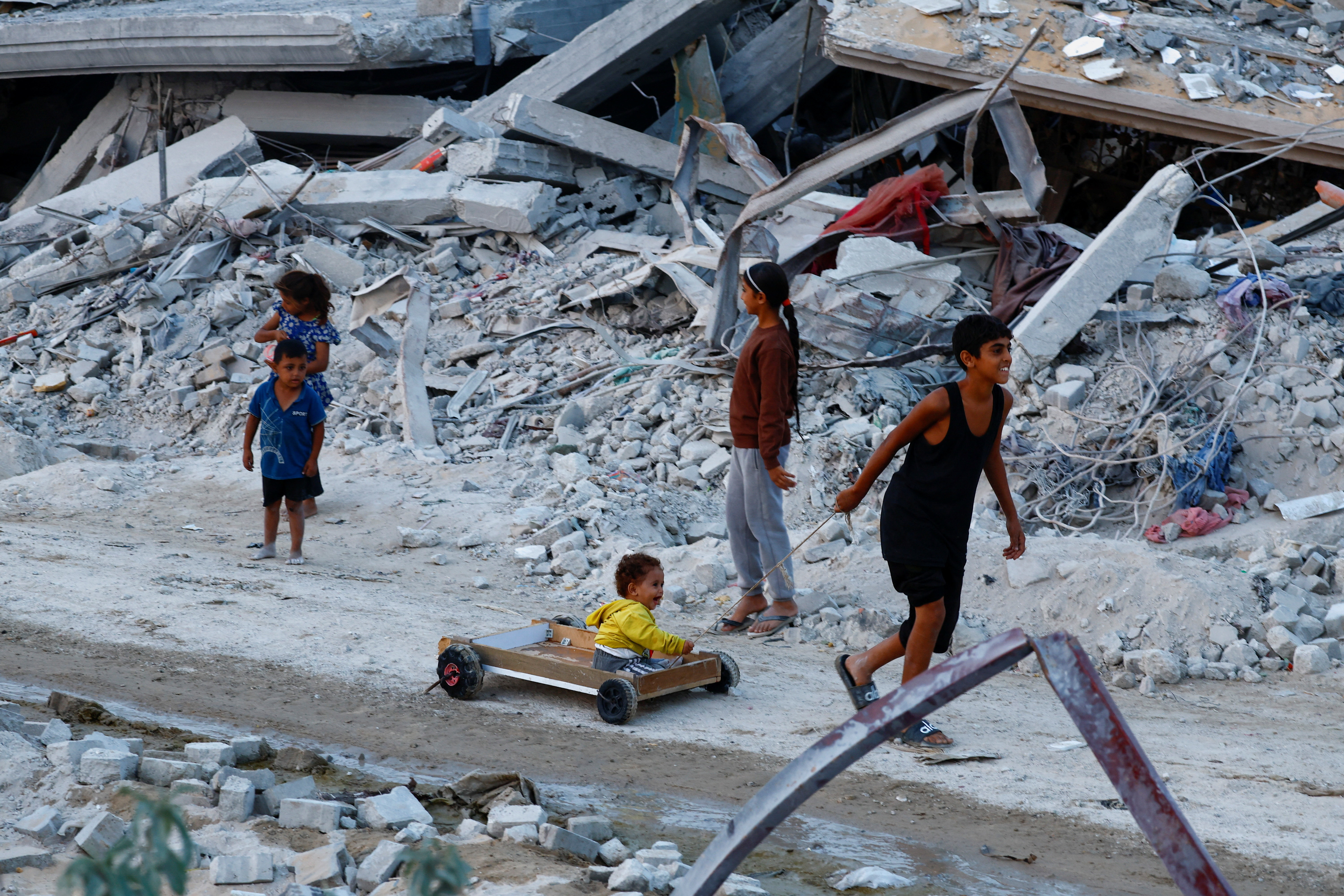 Palestinian children in destruction in northern Gaza's Jabalia