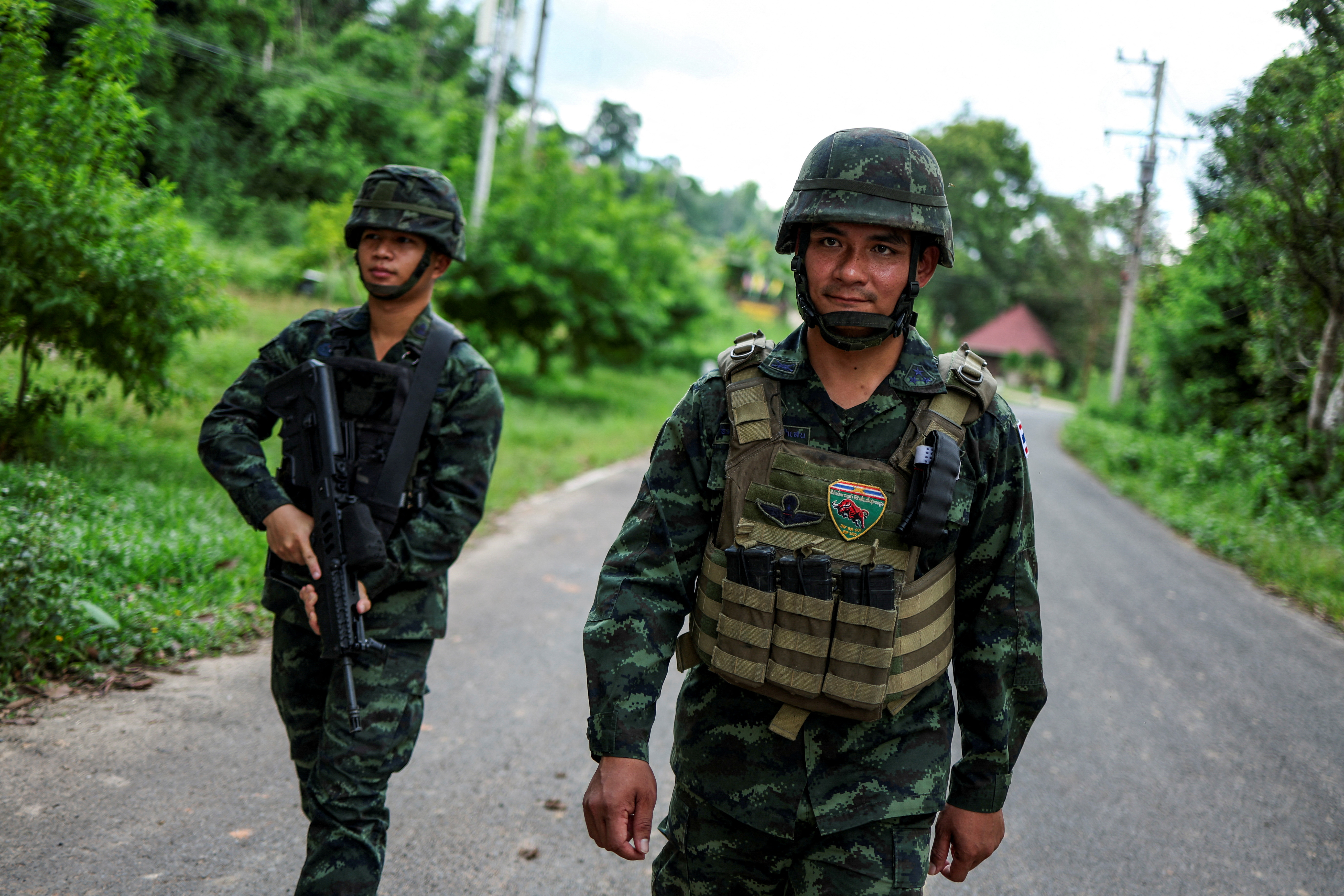 Thai army’s 6021 infantry regiment, who were on patrol near the forested disputed border between Thailand and Cambodia in the Chong Bok area on July 16, walk near a military camp, in Ubon Ratchathani province, Thailand, September 17, 2025.