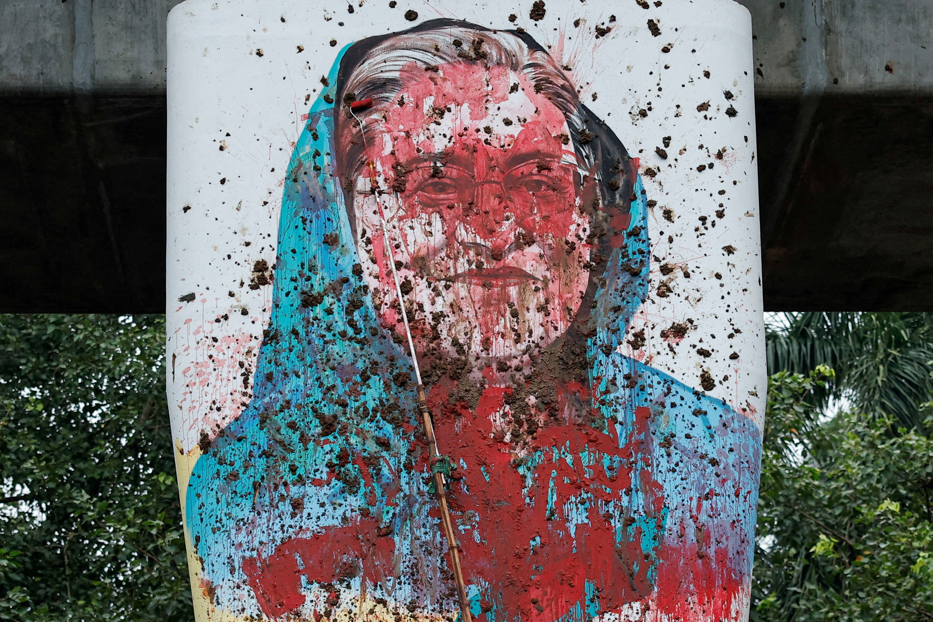 A mural of Bangladeshi Prime Minister Sheikh Hasina was vandalised as students demanded her resignation at the University of Dhaka on August 3, 2024 [Mohammad Ponir Hossain/Reuters]