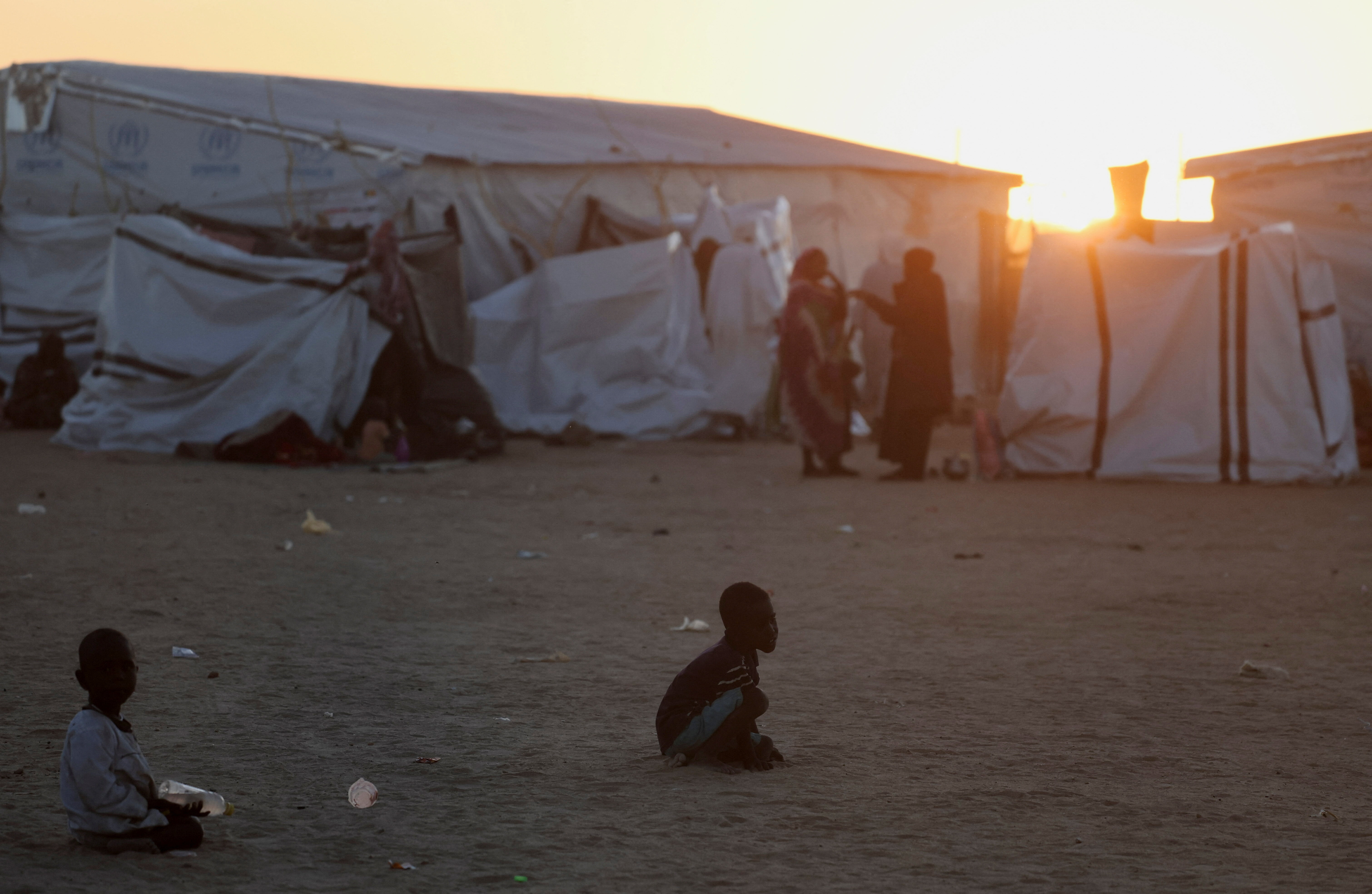 Sudanese refugee children from Al-Fashir play during the sunset over the Tine transit refugee camp, amid the conflict between the paramilitary Rapid Support Forces (RSF) and the Sudanese army, in eastern Chad, November 21, 2025. [File: Amr Abdallah Dalsh/Reuters]