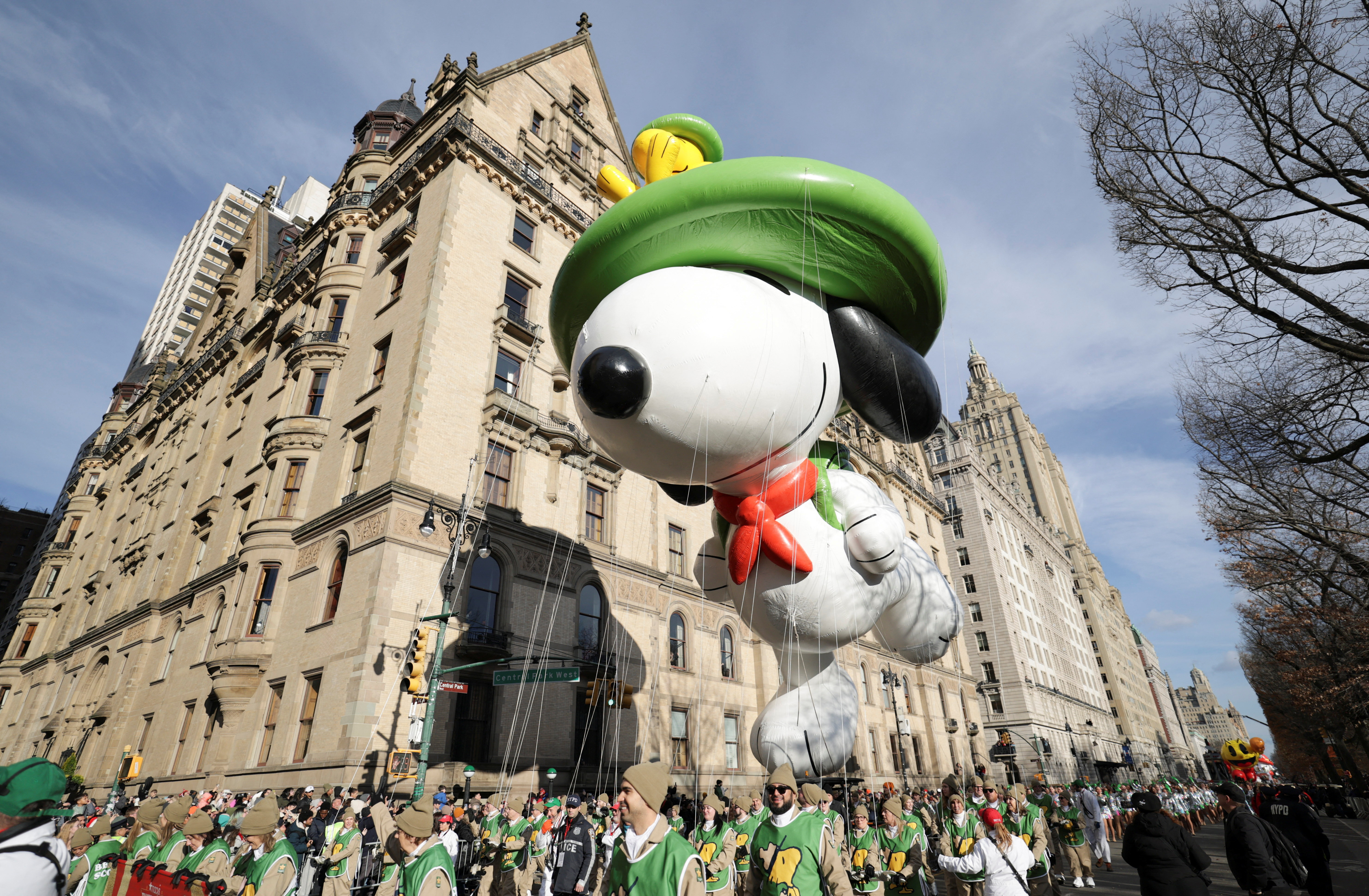 A Snoopy balloon floats through New York during the Macy's Thanksgiving Day parade