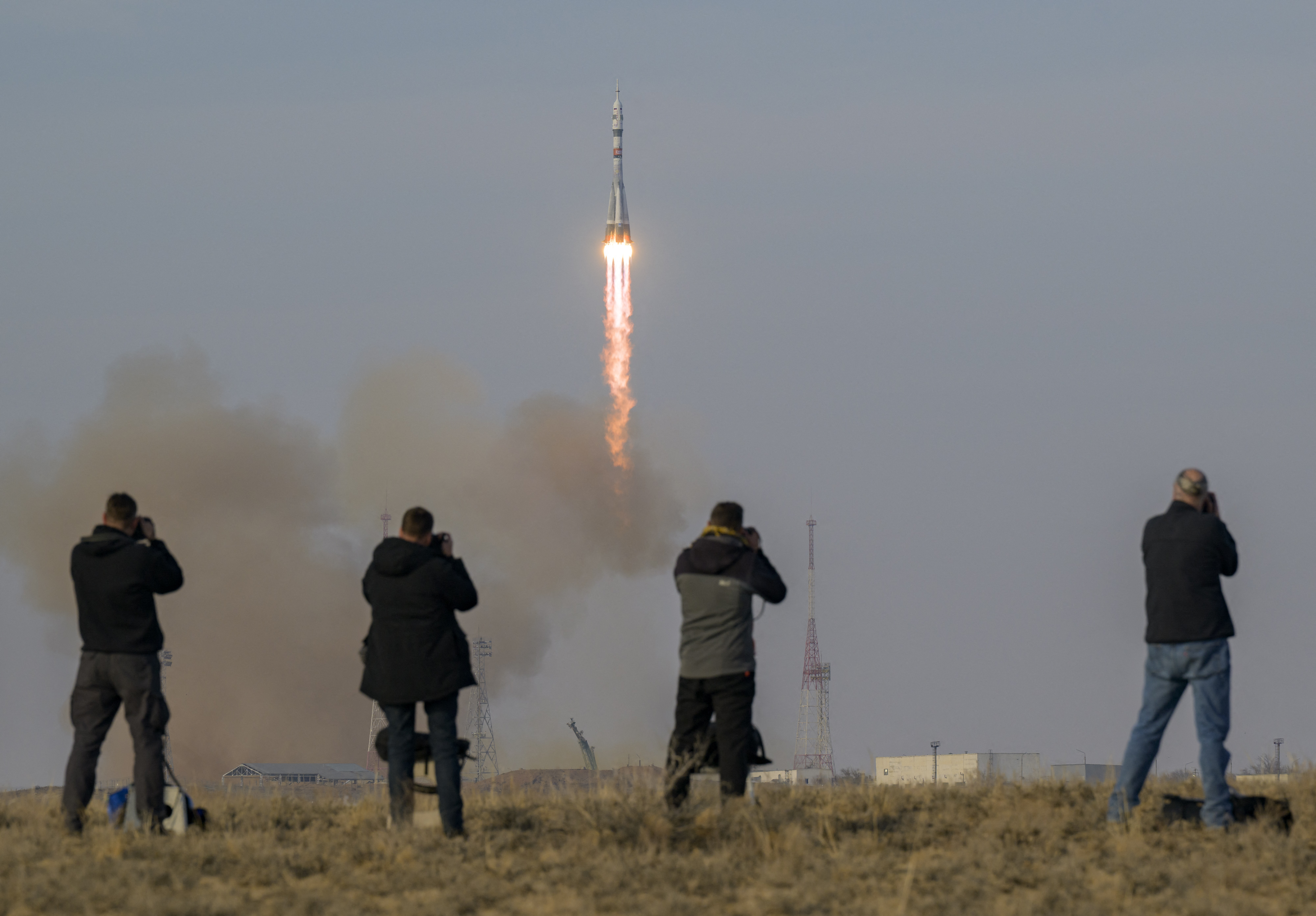 In this handout photograph taken and released by NASA on November 27, 2025, a Soyuz 2.1a booster rocket with the Soyuz MS-28 spacecraft carrying the Expedition 74 crew of Roscosmos cosmonauts Sergey Kud-Sverchkov and Sergei Mikaev and NASA astronaut Chris Williams, blasts off to the International Space Station (ISS) from the Russian-leased Baikonur cosmodrome in Kazakhstan. (Photo by Bill INGALLS / NASA / AFP) / RESTRICTED TO EDITORIAL USE - MANDATORY CREDIT "AFP PHOTO / NASA / BILL INGALLS" - HANDOUT - NO MARKETING NO ADVERTISING CAMPAIGNS - DISTRIBUTED AS A SERVICE TO CLIENTS