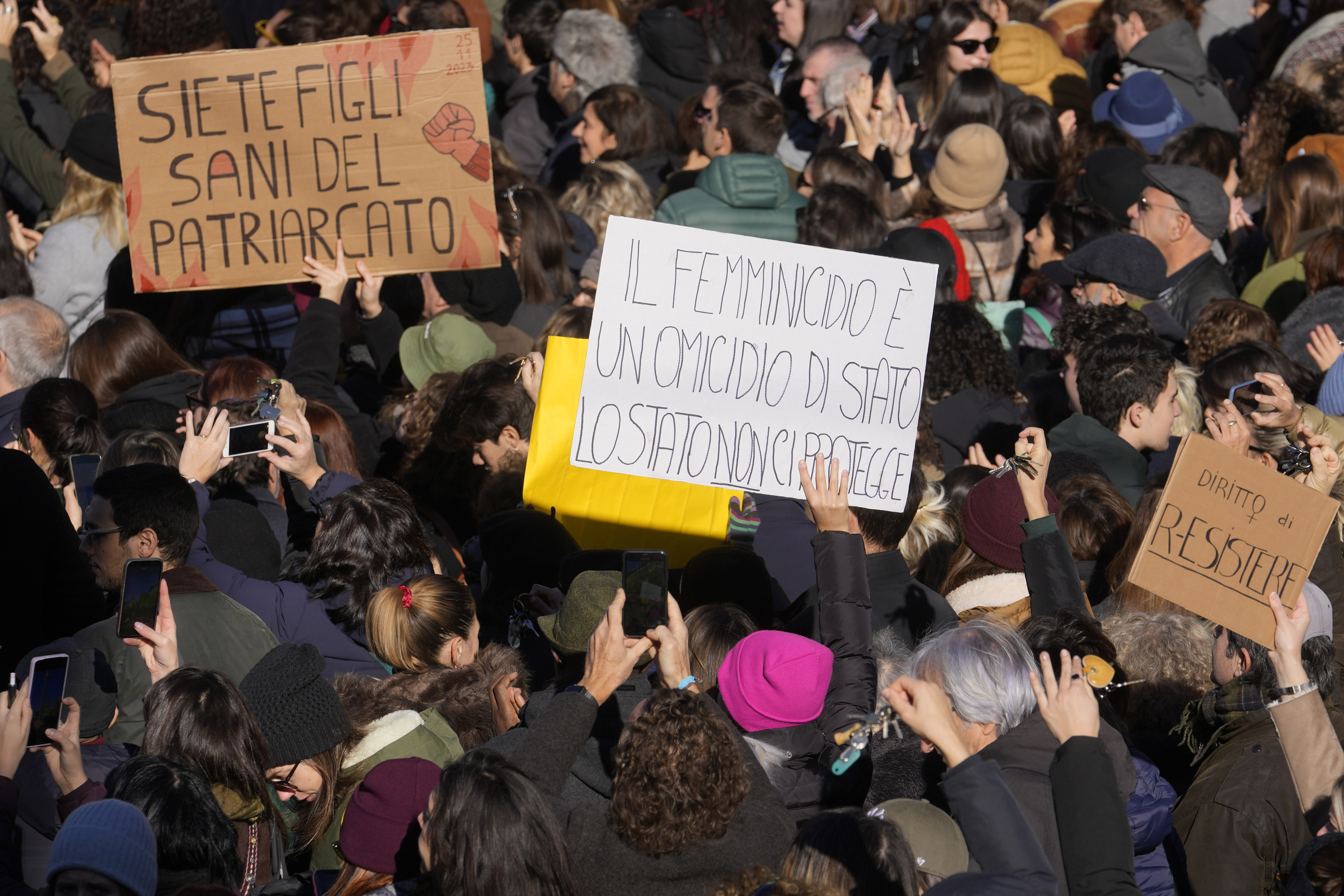 Women hold banners reading &#039;You are healthy children of patriarchy&#039; and &#039;Femicide is a state murder, the state does not protect us&#039; during a gathering for the International Day for the Elimination of Violence Against Women in Milan, Italy, on November 25, 2023 [Luca Bruno/AP Photo]