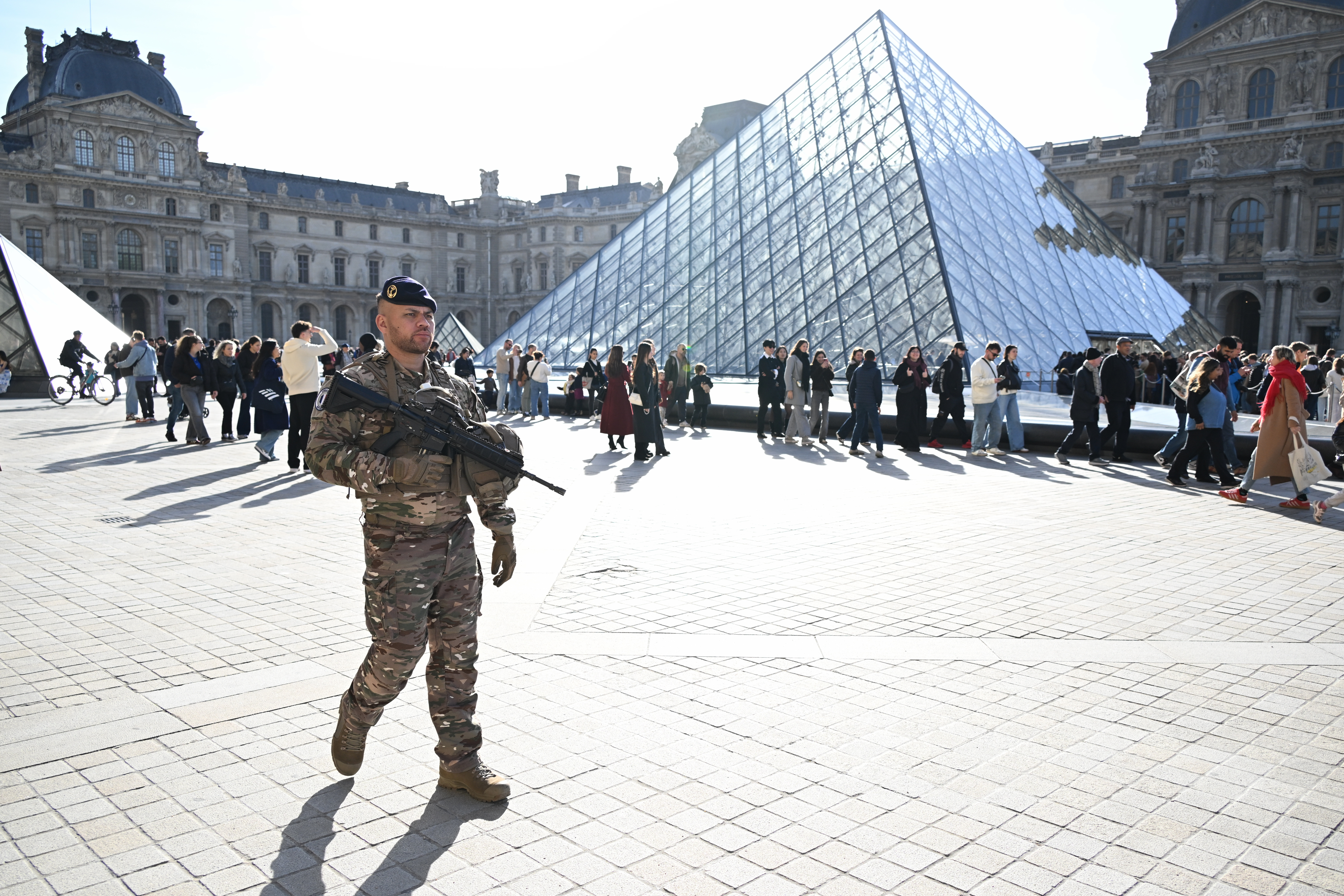 A soldier patrols in the courtyard of the Louvre museum in Paris, France on October 30, 2025.