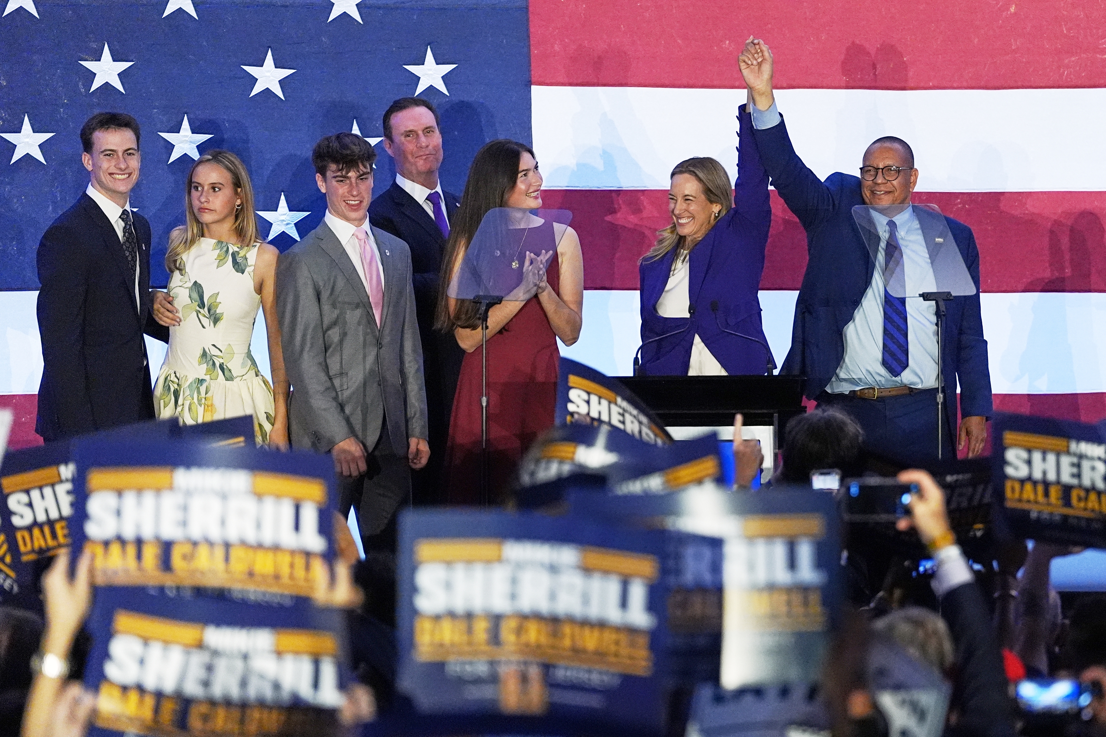 New Jersey Democratic Gov. elect Mikie Sherrill and Lt. Gov. elect Dale Caldwell celebrate during an election night party in East Brunswick, N.J., Tuesday, Nov. 4, 2025.