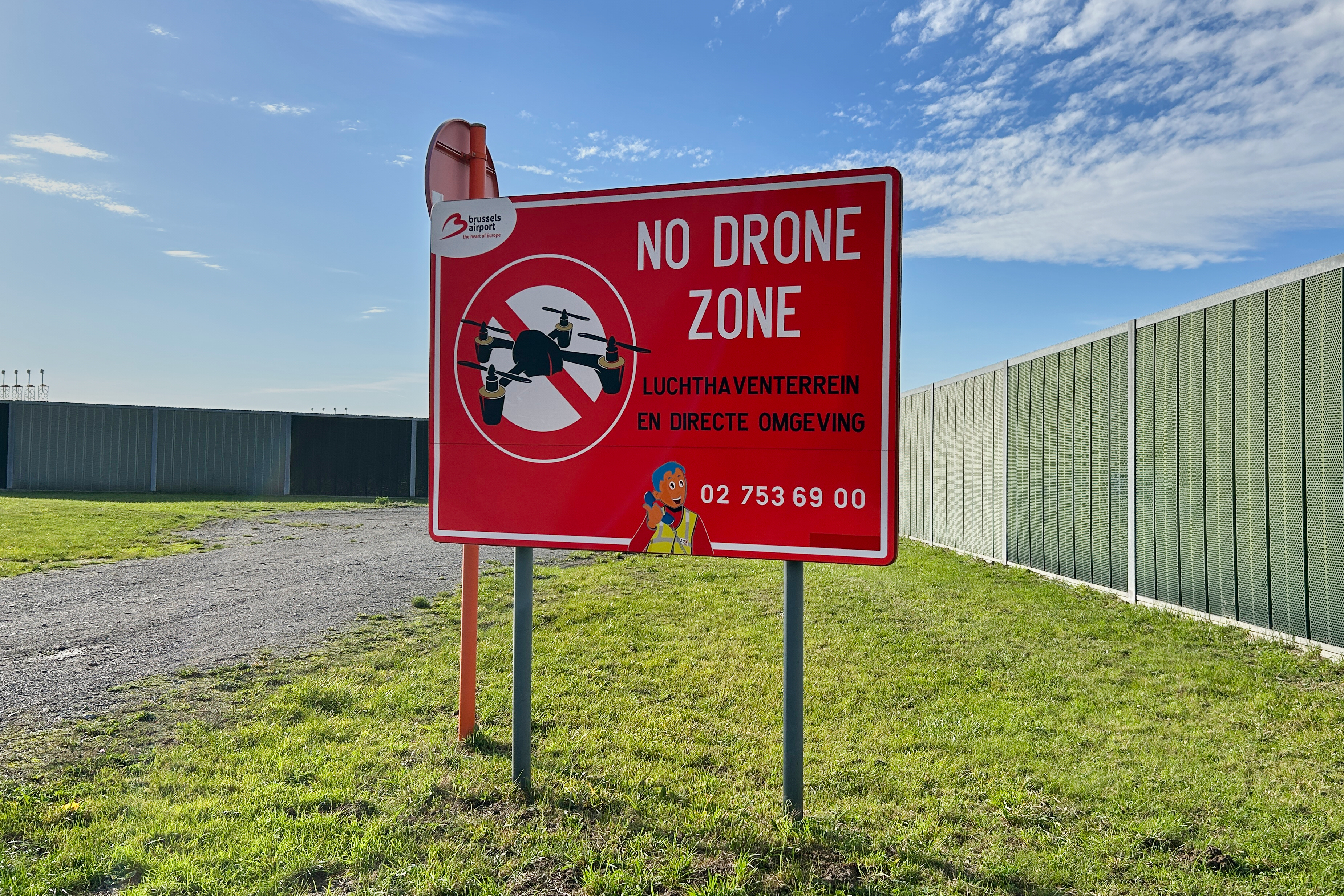 A 'no drone' sign stands just outside the perimeter of Brussels International Airport in Zaventem, Belgium on November 5, 2025.