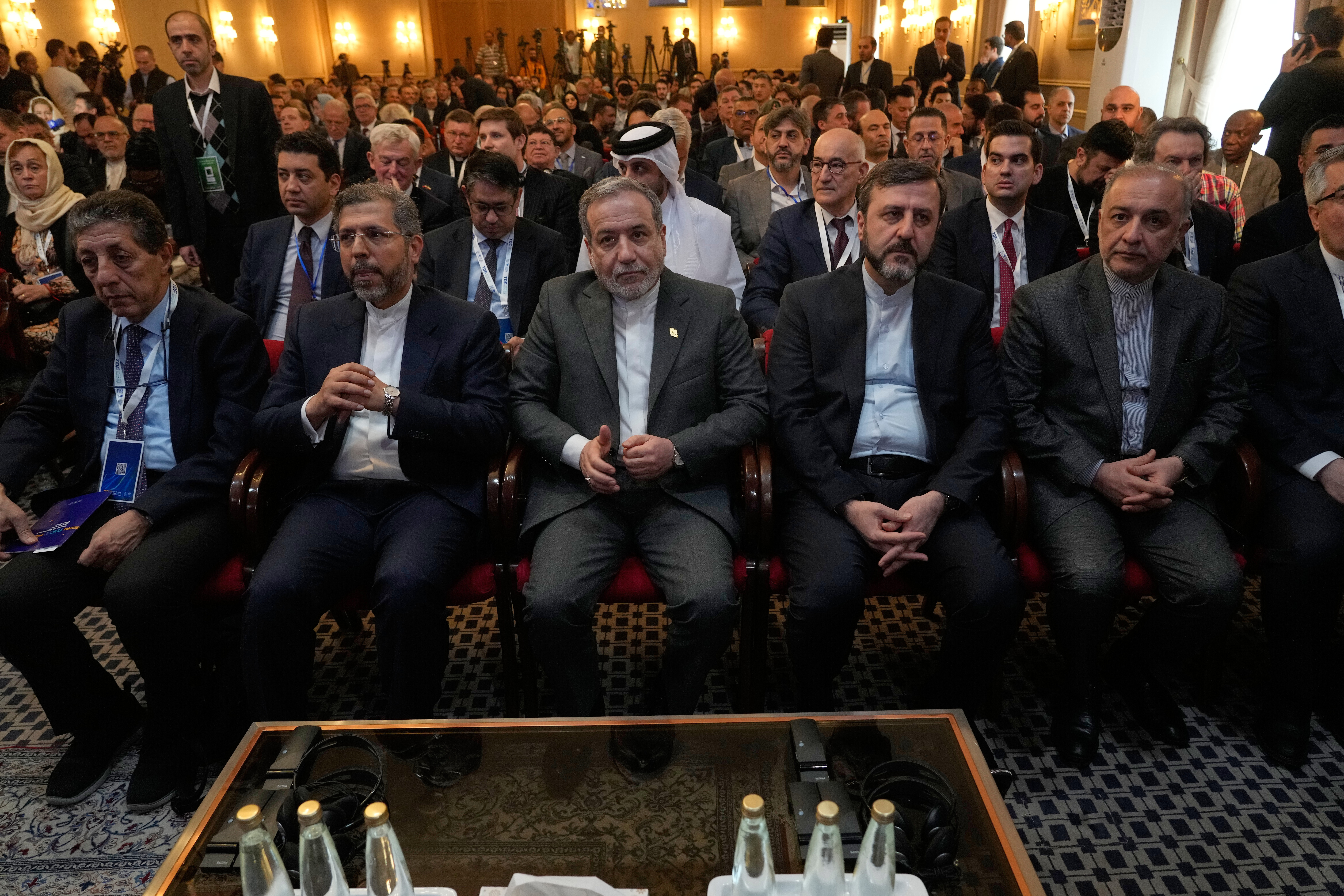 Iranian Foreign Minister Abbas Araghchi, centre, attends a conference called International Law Under Assault: Aggression and Self-Defence in Tehran on November 16, 2025 [Vahid Salemi/AP]