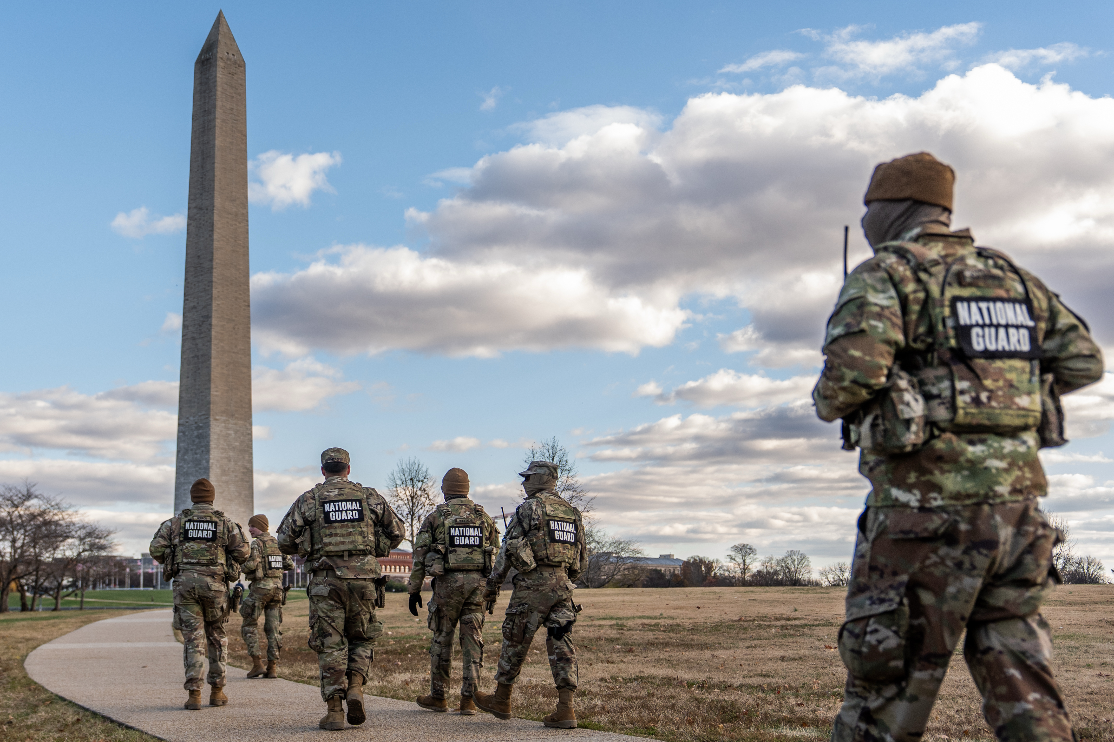 National Guardsmen patrol in front of the Washington Monument on the National Mall, Friday, Nov. 28, 2025, in Washington. (AP Photo/Julia Demaree Nikhinson)