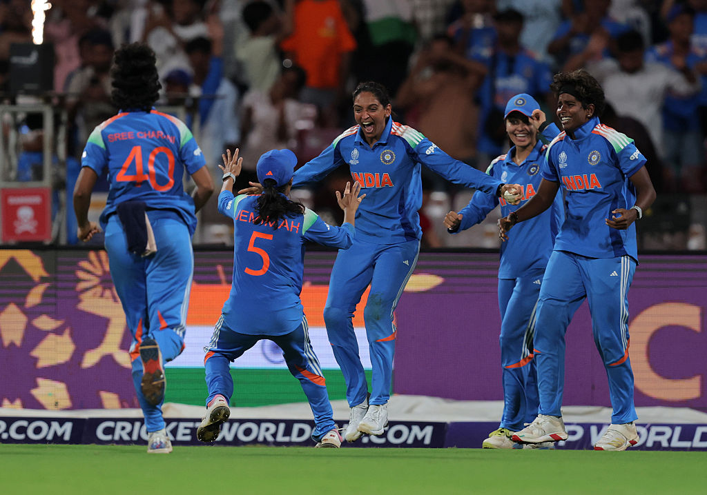 Harmanpreet Kaur of India celebrates with team mate Jemimah Rodrigues (obscured) following victory in the ICC Women's Cricket World Cup India 2025 final