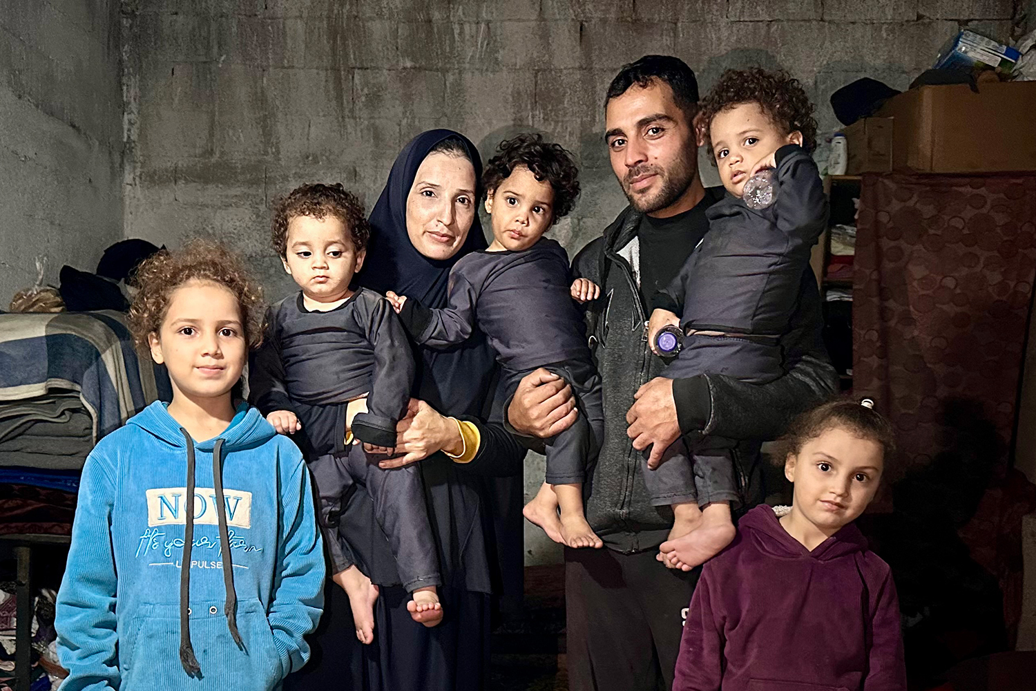 The family poses for a portrait