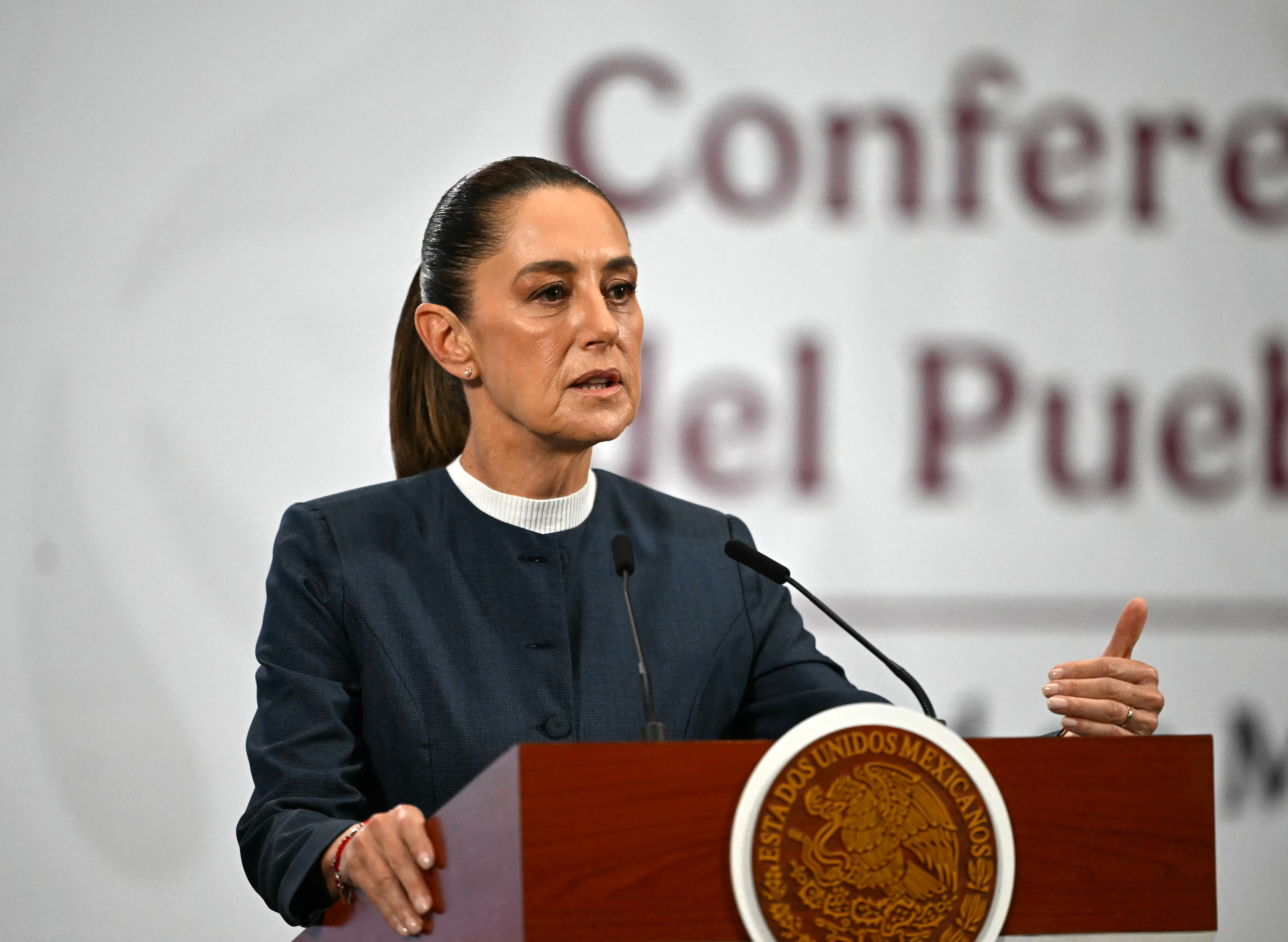 Mexico's President Claudia Sheinbaum speaks during her daily press conference where she announced progress in the organization of the upcoming FIFA 2026 World Cup, at Palacio Nacional in Mexico City on November 3, 2025. (Photo by CARL DE SOUZA / AFP)