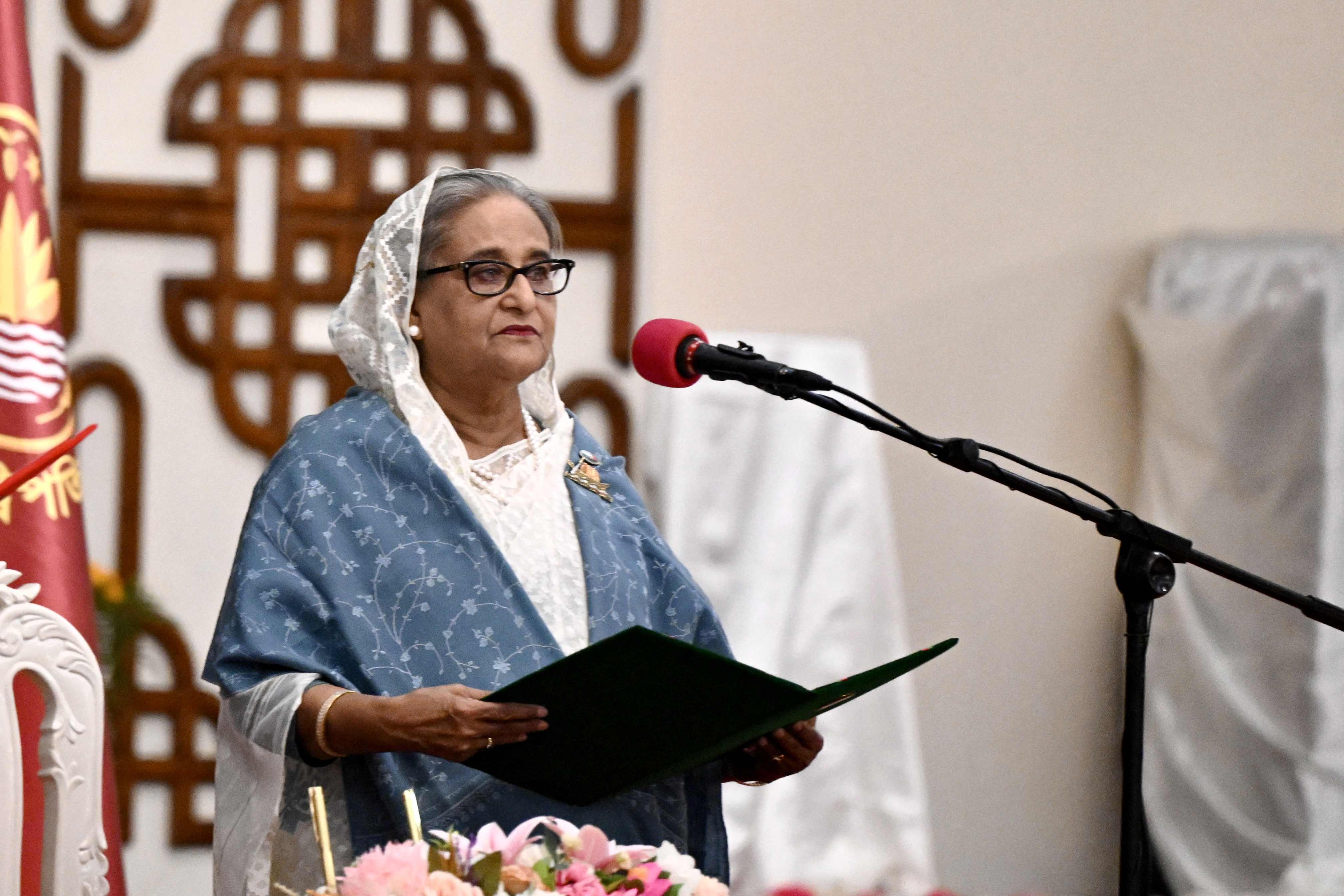 (FILES) Bangladesh's Prime Minister Sheikh Hasina speaks as she is sworn in for a fifth term at the Presidential Palace in Dhaka on January 11, 2024.