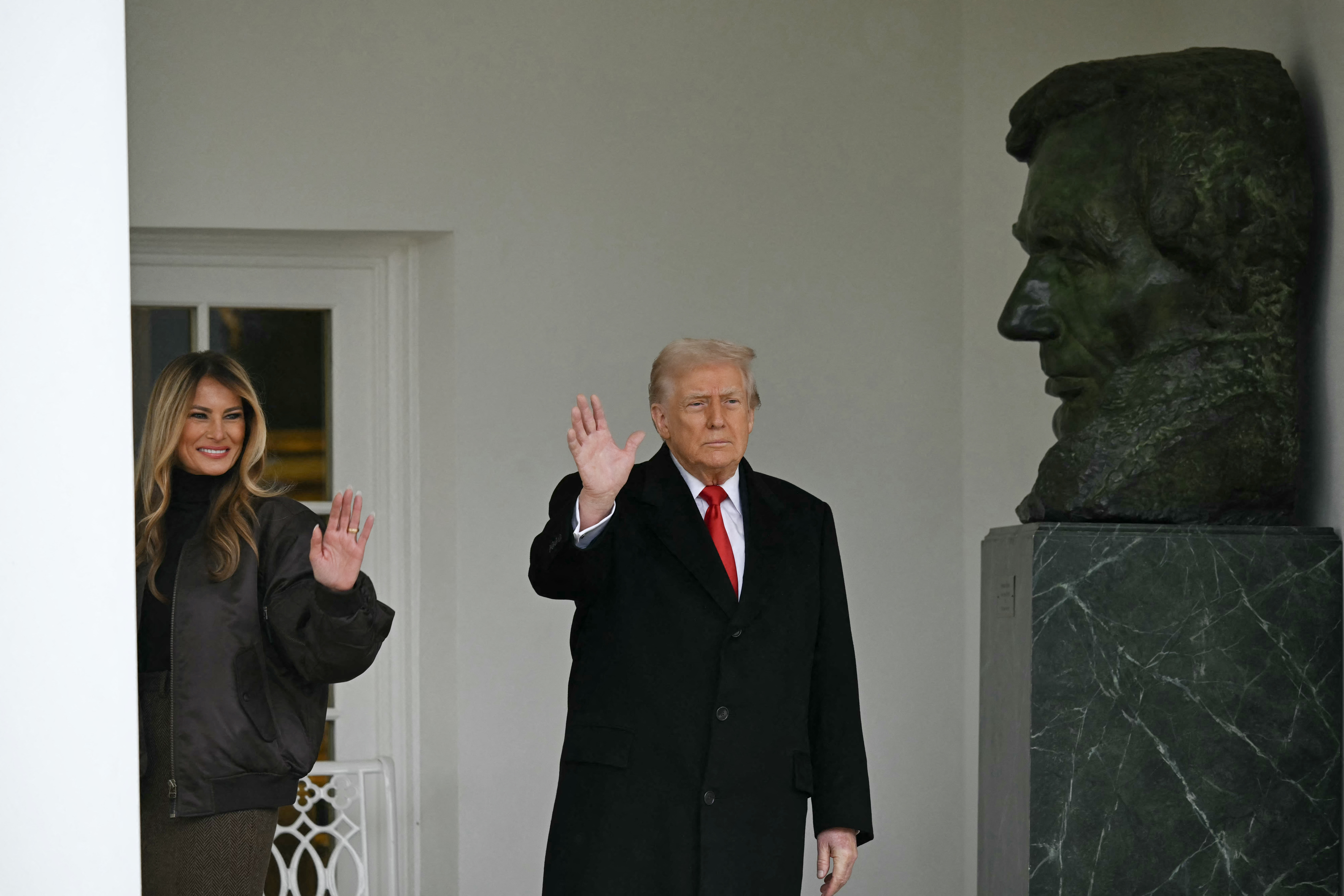 US President Donald Trump and First Lady Melania Trump wave
