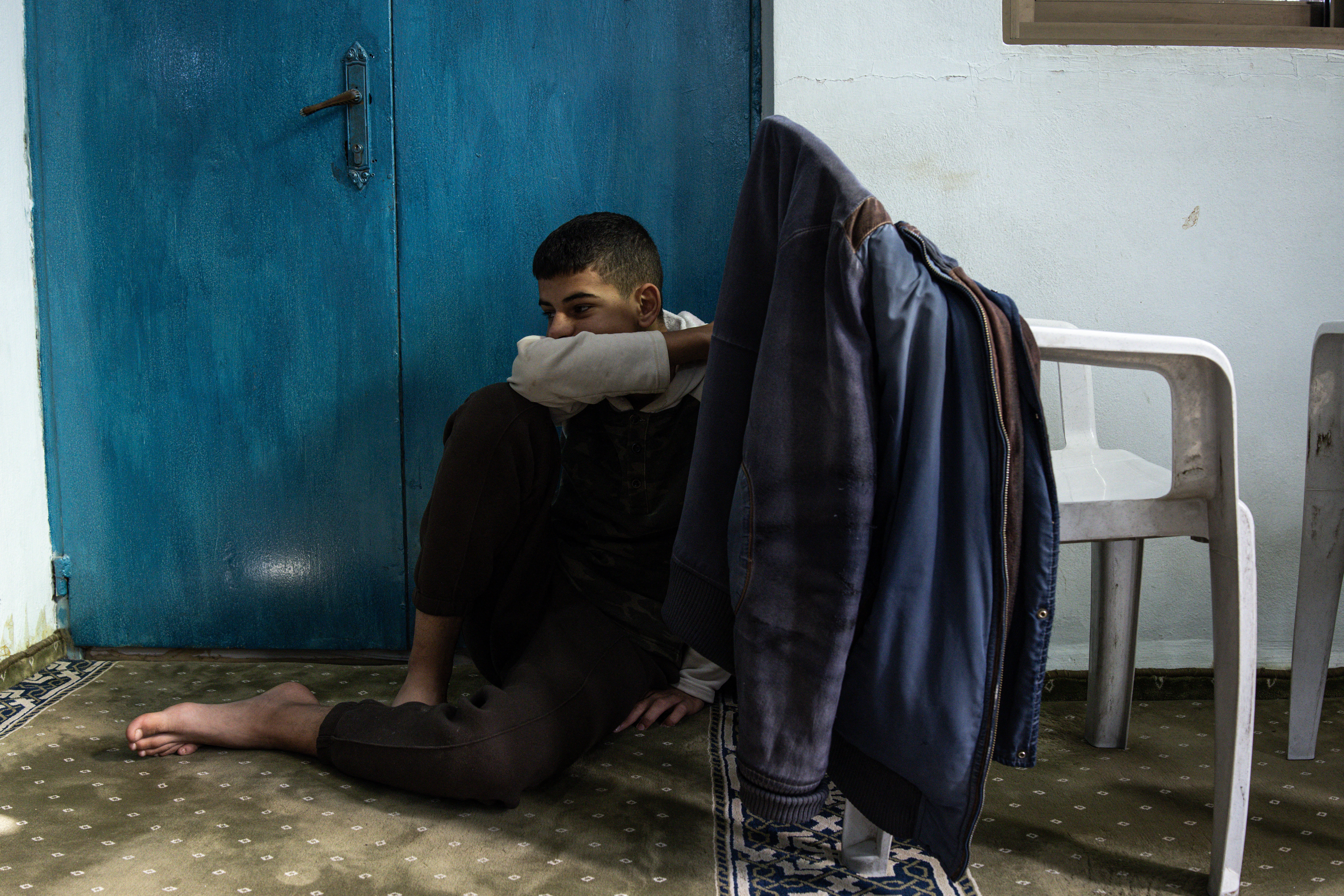 A man mourns during the funeral of Osama Kamil, a Palestinian who was killed the previous night in a large Israeli military operation in the occupied West Bank, in the town of Qabatiya, near Tubas in the north of the Palestinian territory, on November 27, 2025.