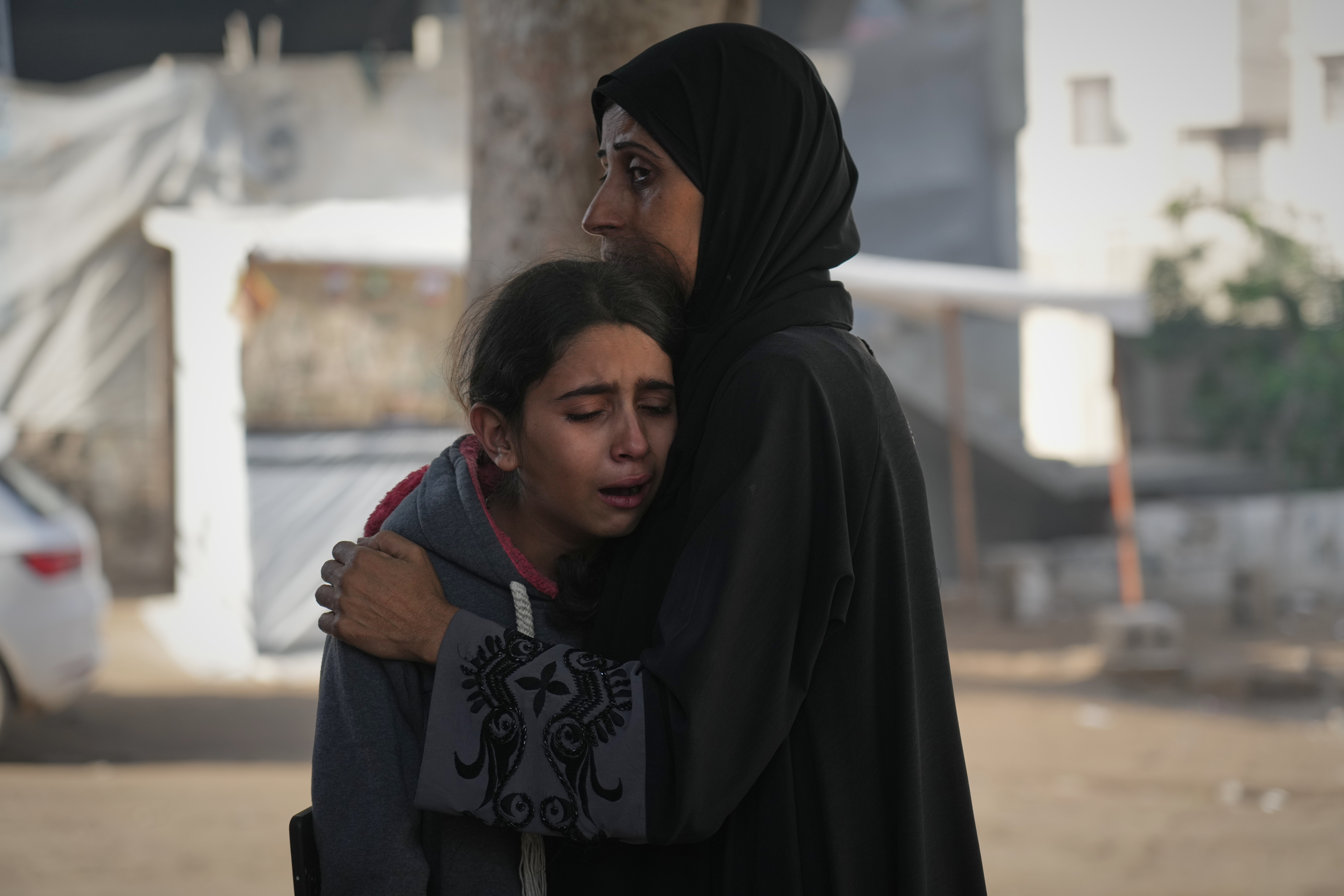 Palestinians mourn their relatives killed in an Israeli army strike, at Shifa Hospital in Gaza City, Thursday, Nov. 20, 2025. (AP Photo/Jehad Alshrafi)