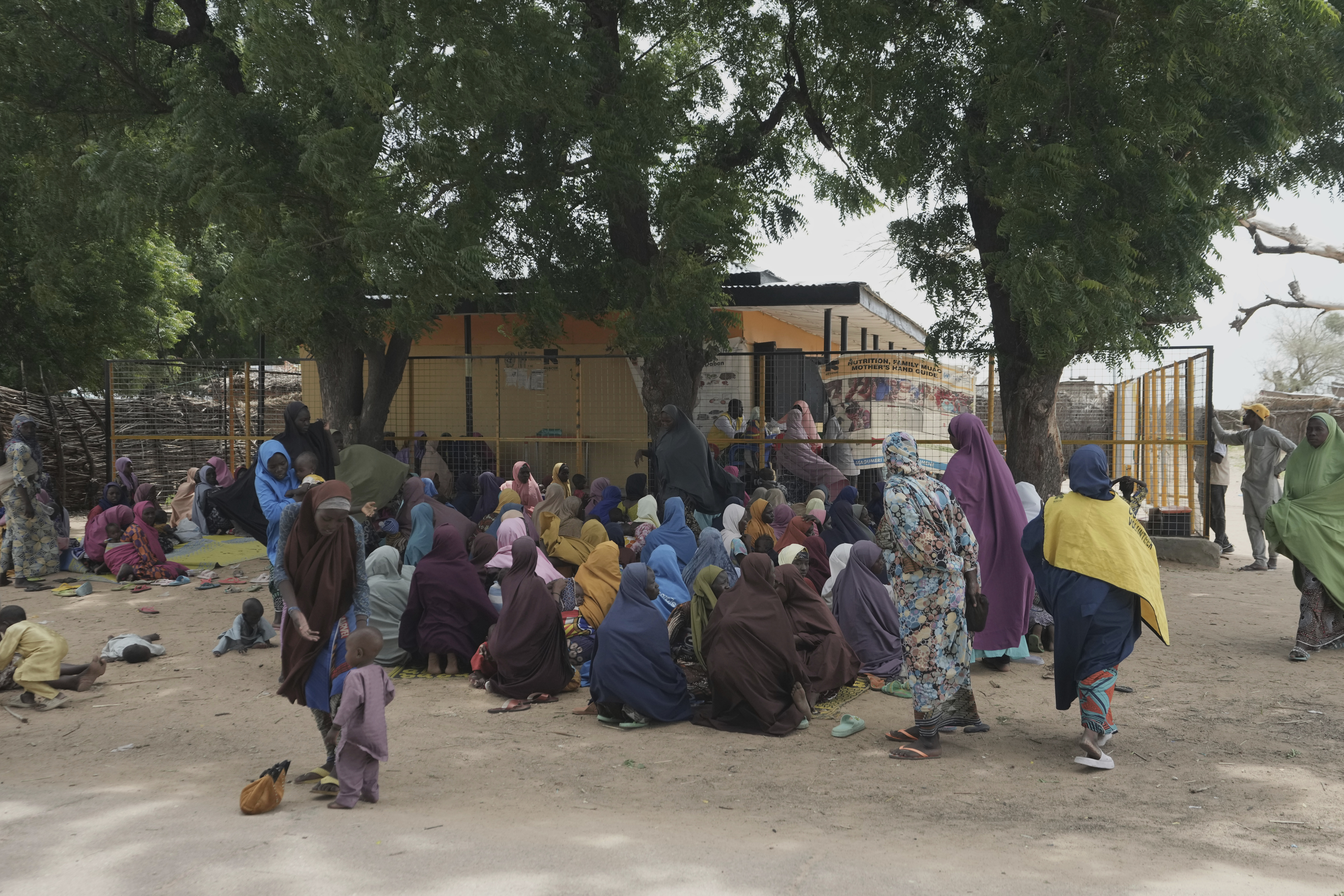 Women wait to be attended to at a facility run by an aid group.