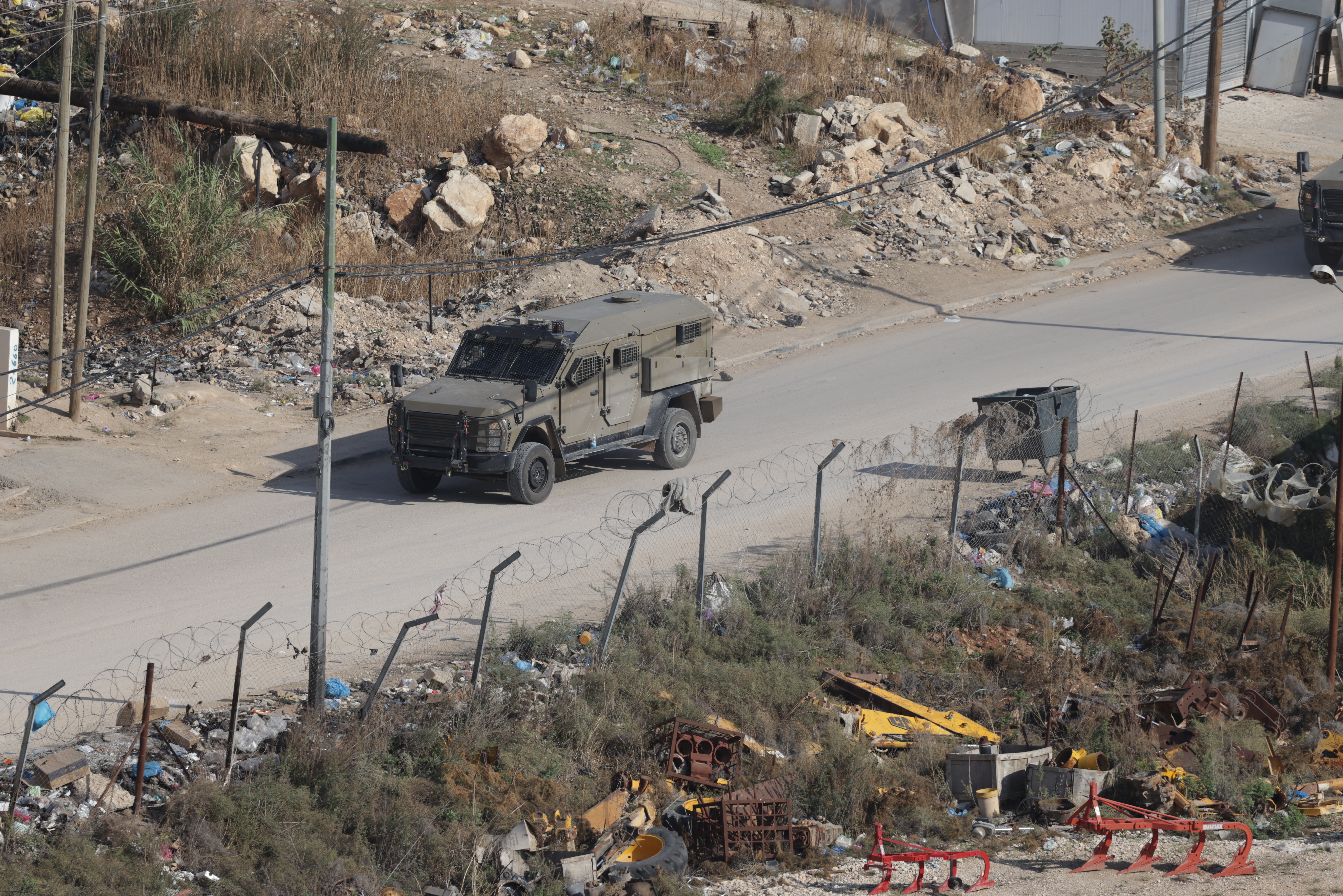 epa12554849 Israeli troops conduct a military operation at Al Fara'a refugee camp near the West Bank city of Tubas, 28 November 2025. According to the Palestinian news agency Wafa, Israeli forces are continuing their military operation in the Tubas governorate, north of the West Bank, for the third consecutive day, imposing a curfew and deploying heavily across most areas of the governorate, with more than 70 injuries since the start of the assault. EPA/ALAA BADARNEH