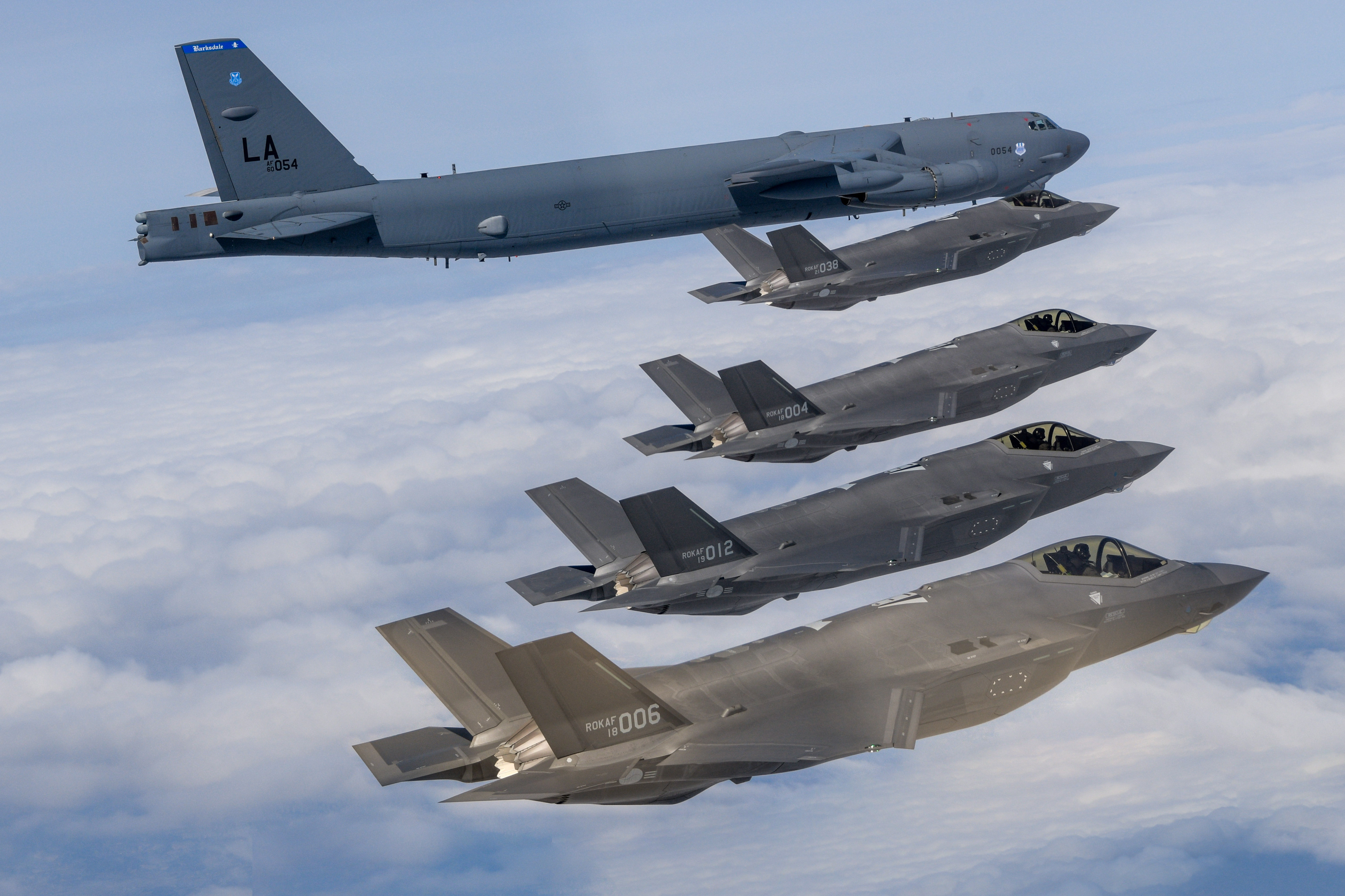 UNDISCLOSED LOCATION, SOUTH KOREA - APRIL 14: In this handout image released by the South Korean Defense Ministry, a U.S. Air Force B-52H strategic bomber (top) flying with South Korean Air Force F-35A fighter jets during a joint air drill on April 14, 2023 at an undisclosed location in South Korea. South Korea and the United States held joint air drills, involving at least one B-52H strategic bomber, a day after North Korea test-fired a new intercontinental ballistic missile (ICBM). (Photo by South Korean Defense Ministry via Getty Images)
